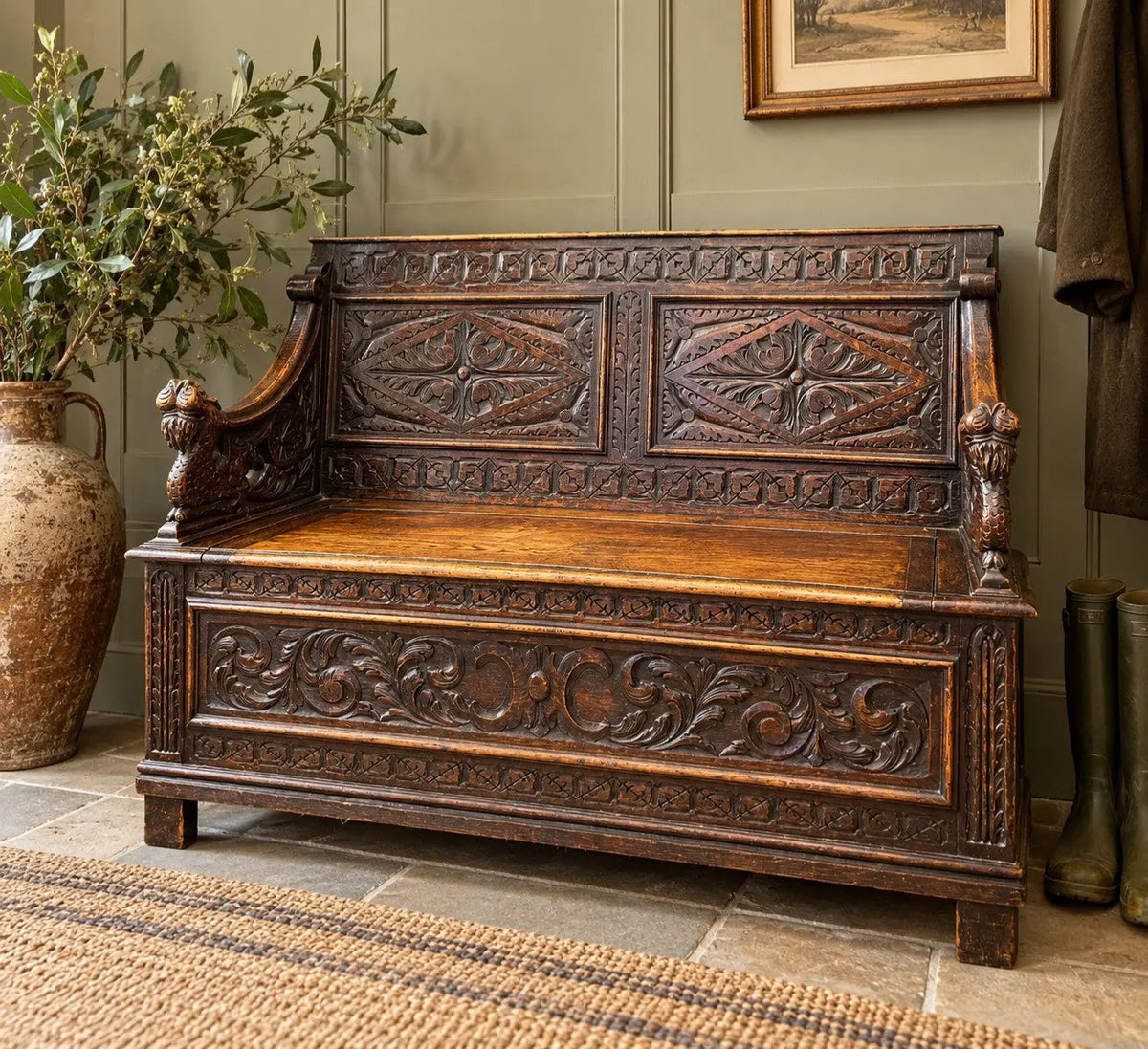 Victorian carved oak hall bench, brown, intricate Gothic Revival carvings and mythical figures.