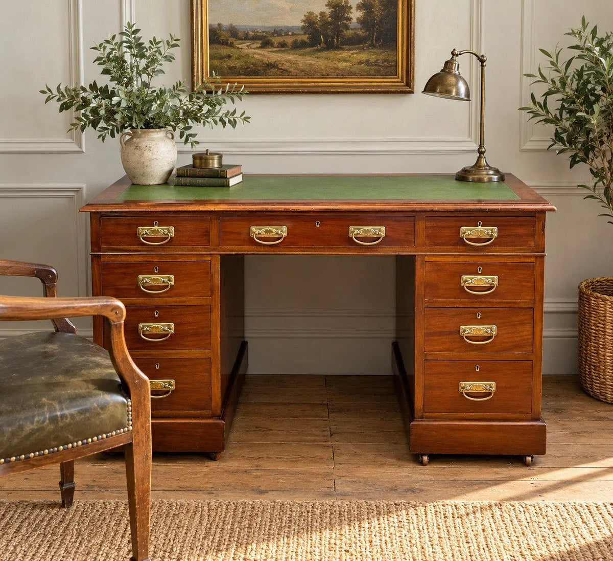 Victorian walnut writing desk brown with green leather top and brass drop handles.