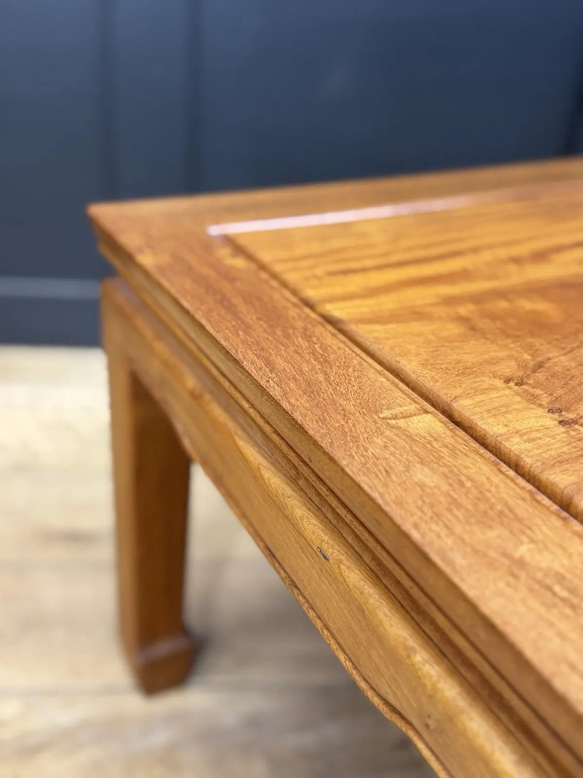 Contemporary Chinese hardwood coffee table brown rectangular top with framed construction and square legs.