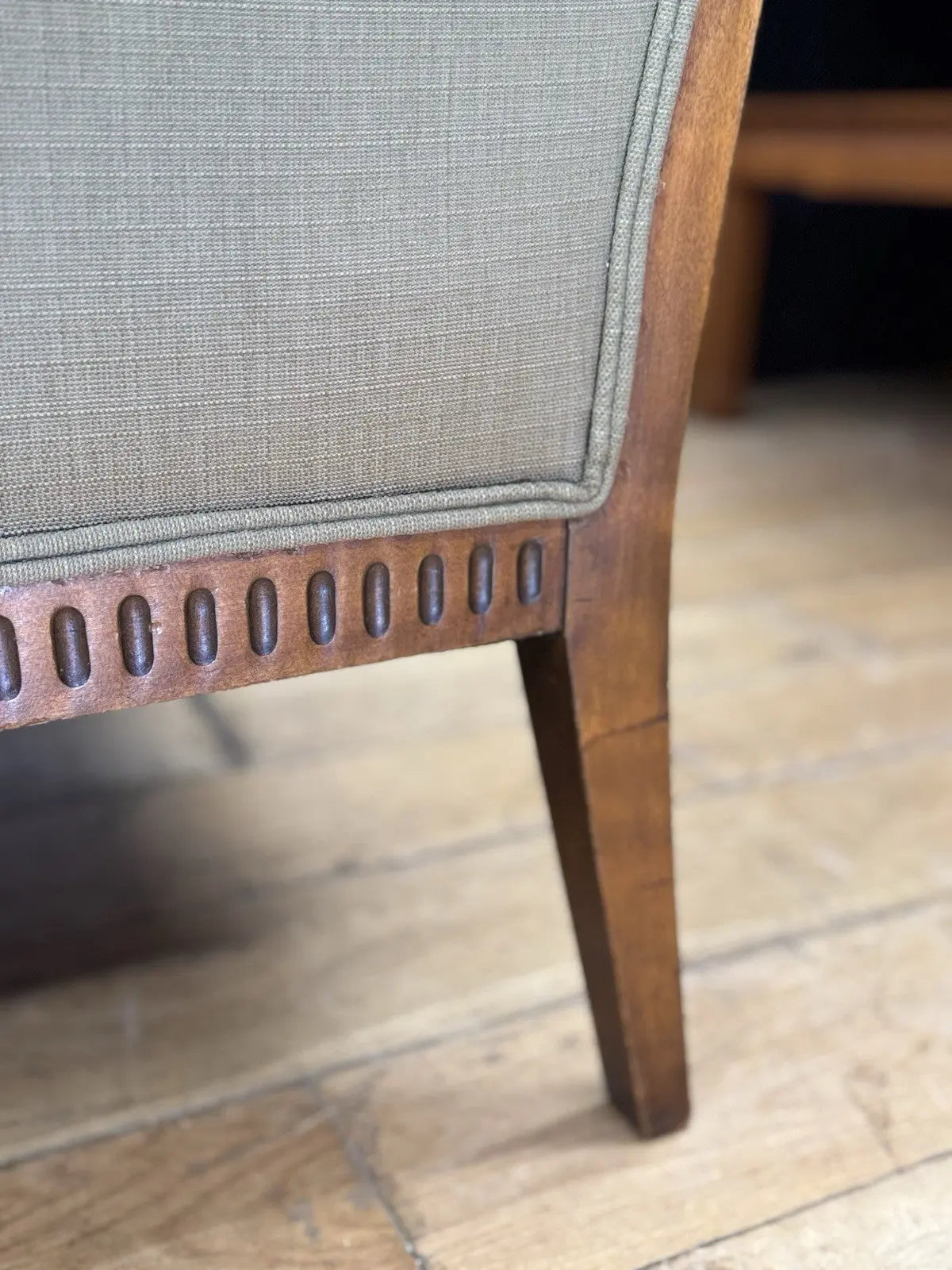 French's green Art Deco armchairs with walnut scroll arms and tapered legs.