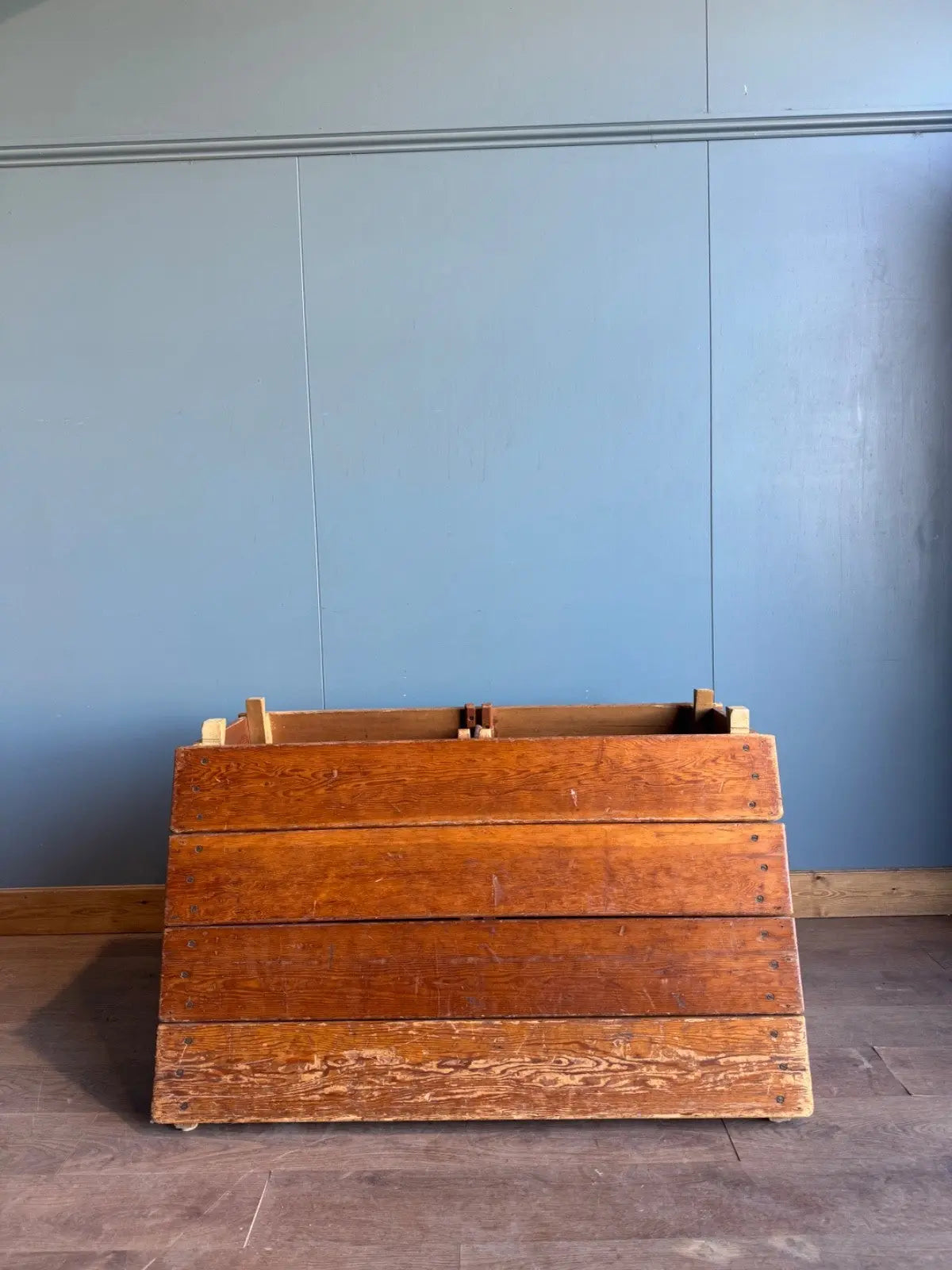 Lodge vintage wooden pommel horse with original maker's label, padded top, and worn patina.