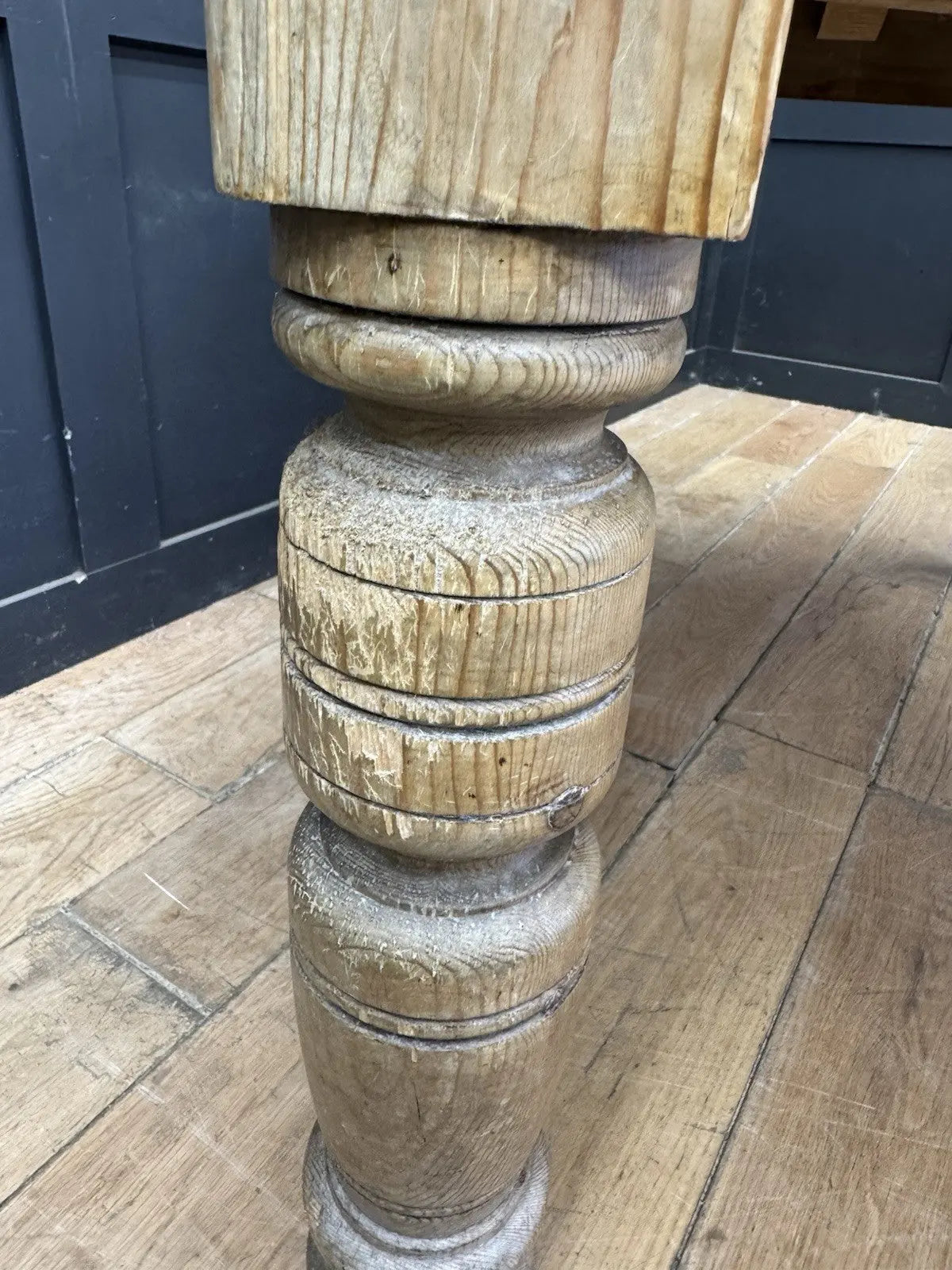 Late Victorian farmhouse kitchen table, scrubbed pine, ring-turned legs, single drawer, timeworn surface.
