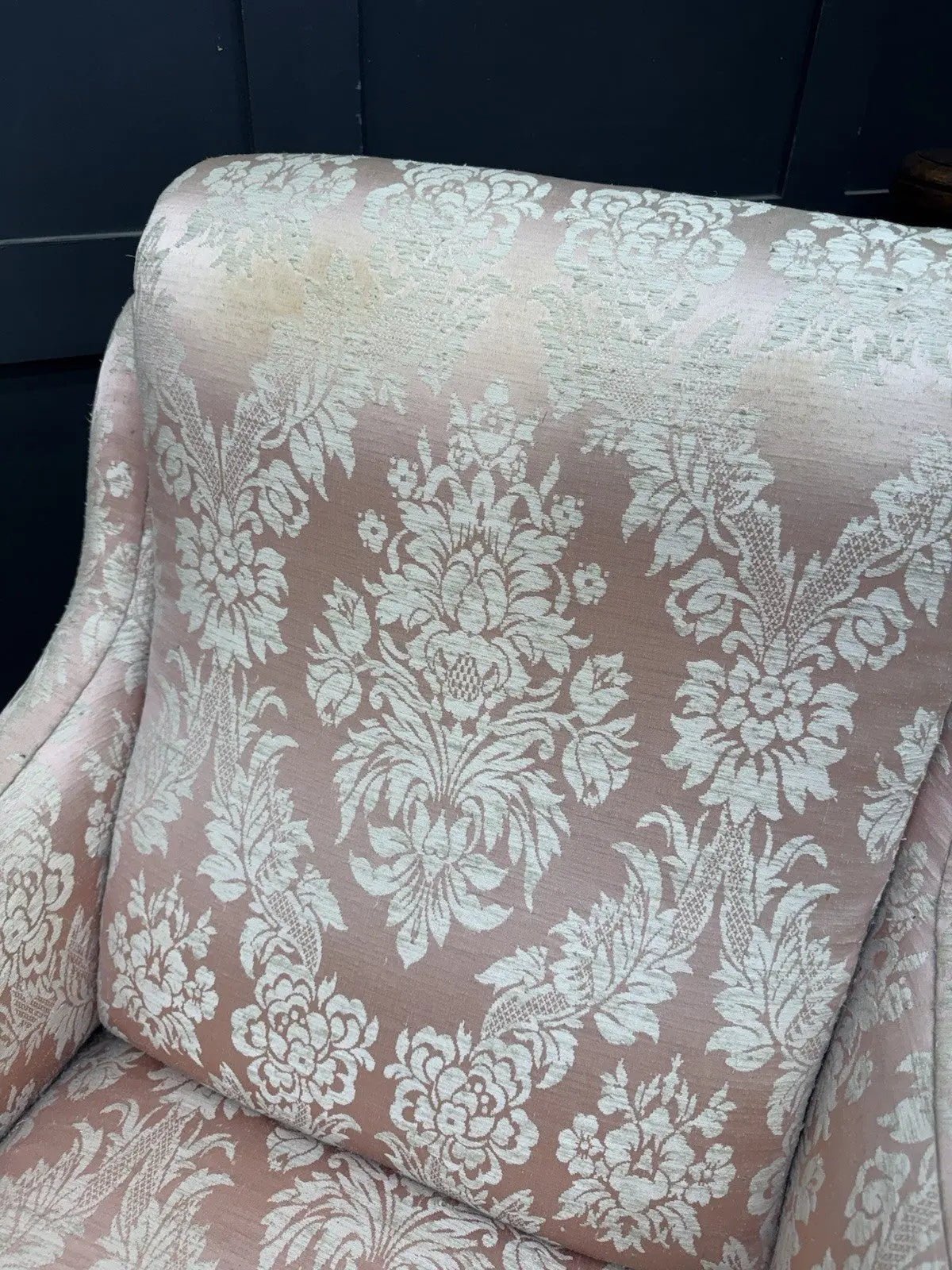 Late Victorian armchair pink silk damask floral pattern with curved rolled arms.