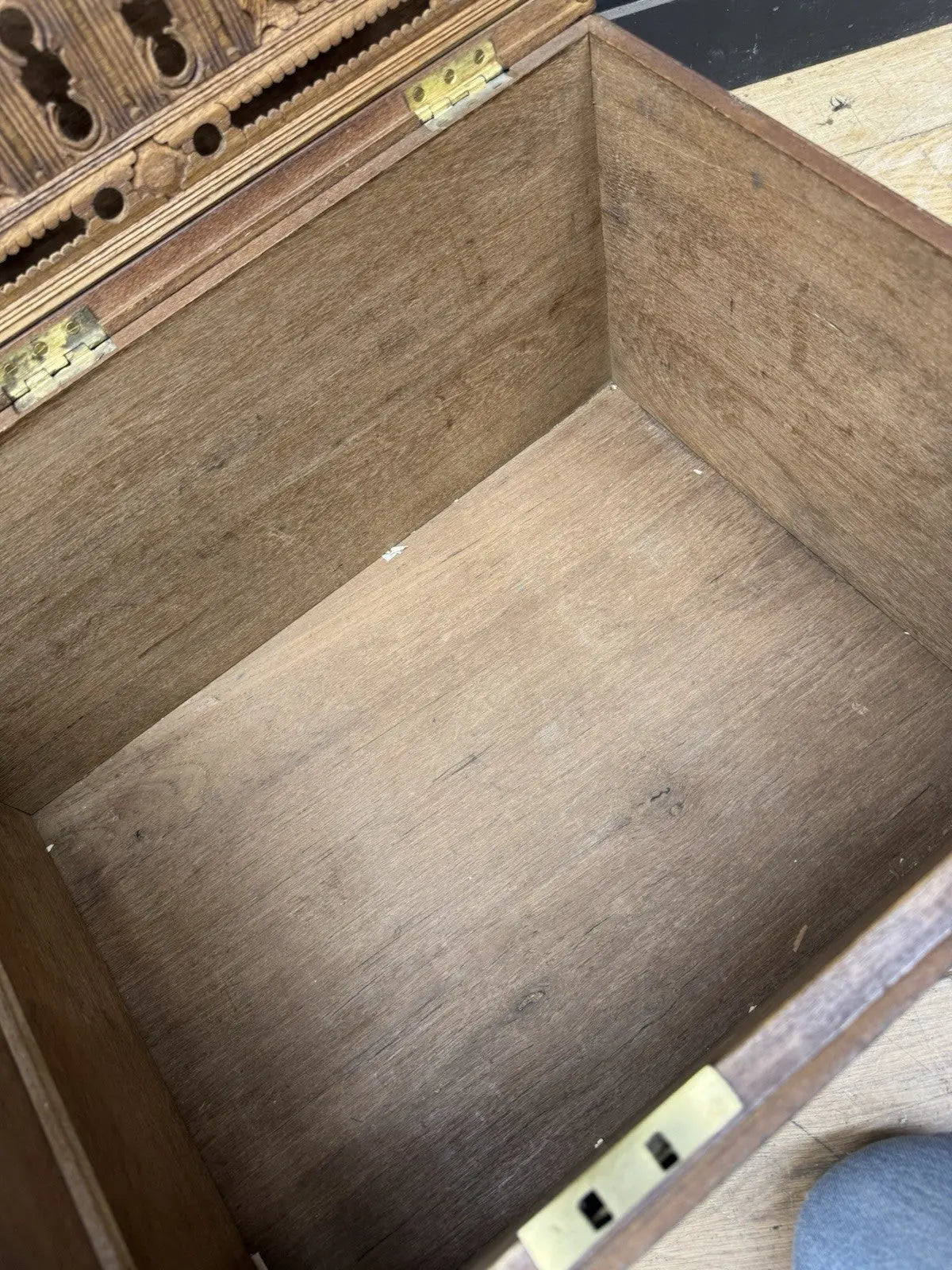 Antique Anglo-Burmese teak campaign chest trunk with brass strapwork and drop-handle.