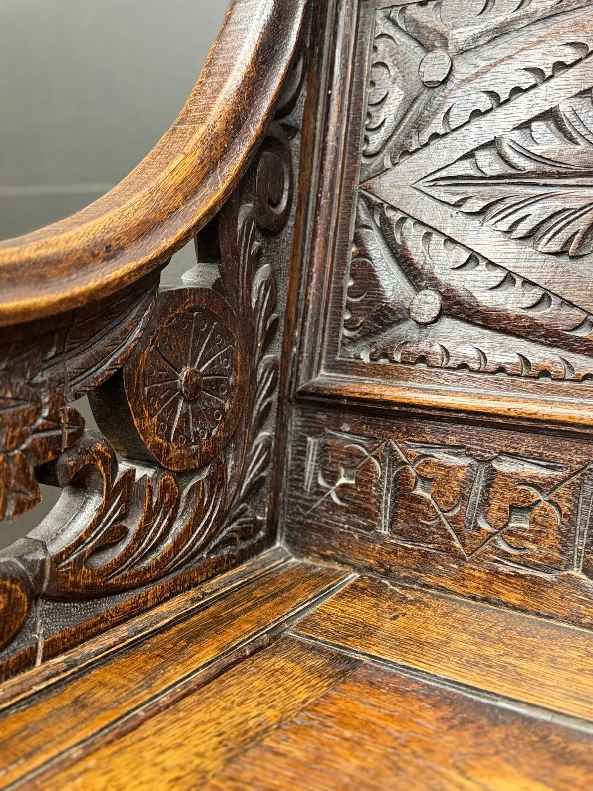 Victorian carved oak hall bench, brown, intricate Gothic Revival carvings and mythical figures.