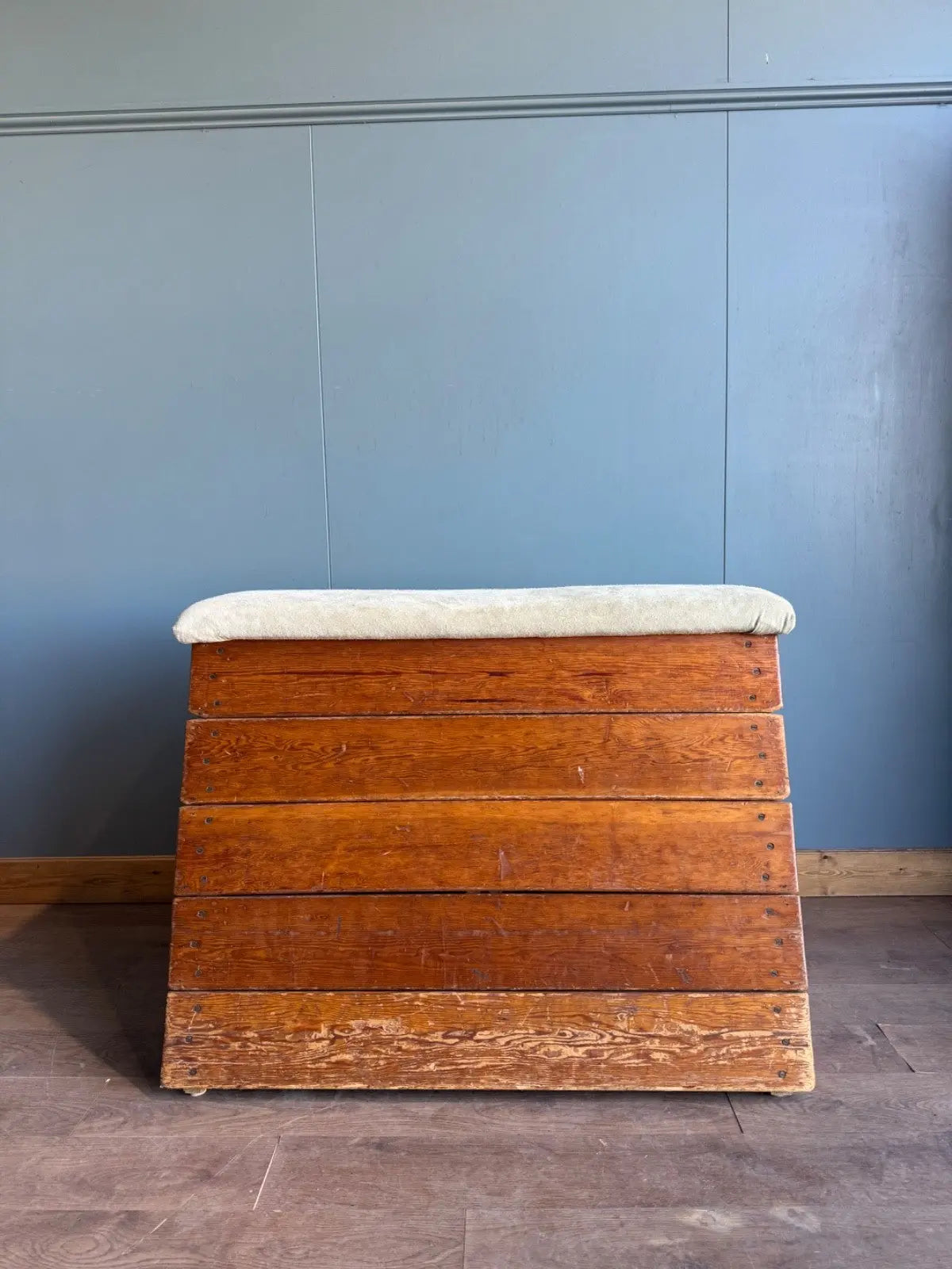 Lodge vintage wooden pommel horse with original maker's label, padded top, and worn patina.