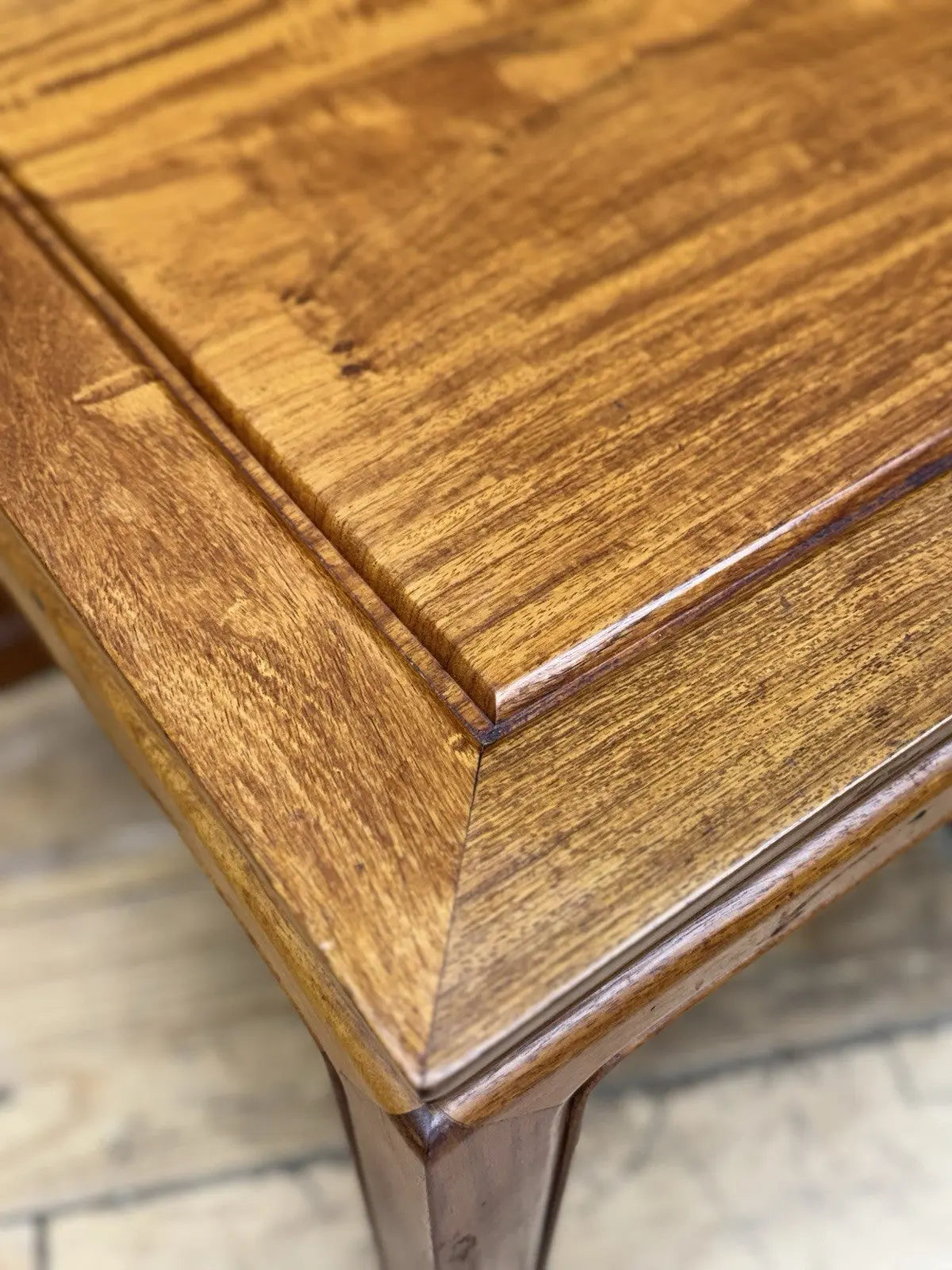 Contemporary Chinese hardwood coffee table brown rectangular top with framed construction and square legs.