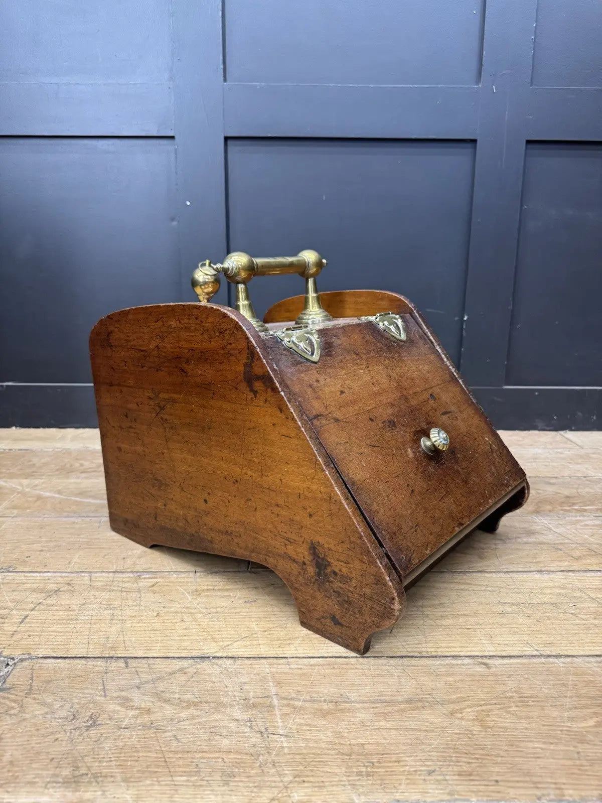 Victorian walnut coal purdonium scuttle box with brass fittings and ornate handle.
