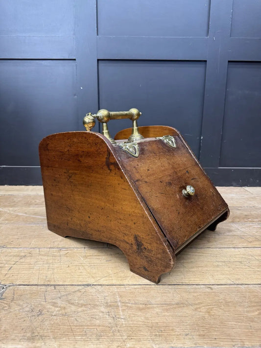 Victorian walnut coal purdonium scuttle box with brass fittings and ornate handle.