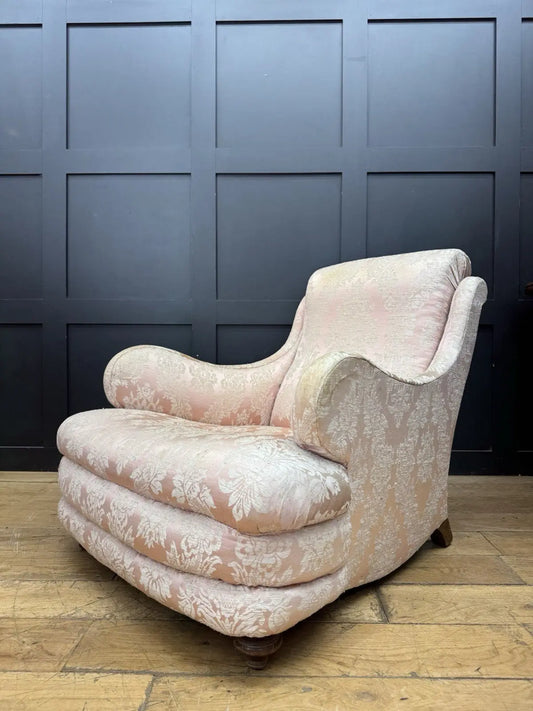 Late Victorian armchair pink silk damask floral pattern with curved rolled arms.