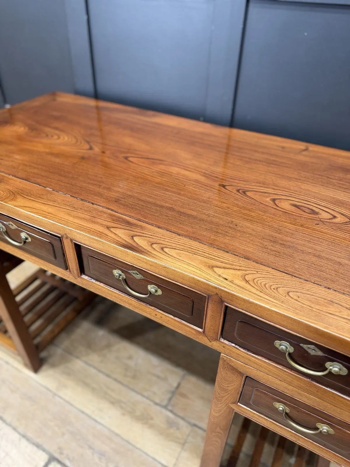 Antique Chinese hardwood writing desk, rich brown finish, elegant traditional pedestal design.