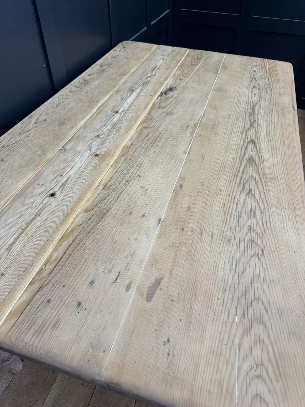 Victorian pine farmhouse dining table brown solid plank top with two drawers and ceramic knobs.