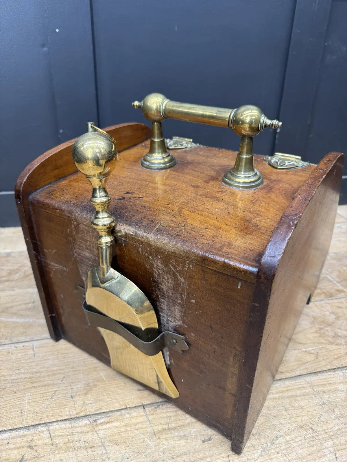 Victorian walnut coal purdonium scuttle box with brass fittings and ornate handle.