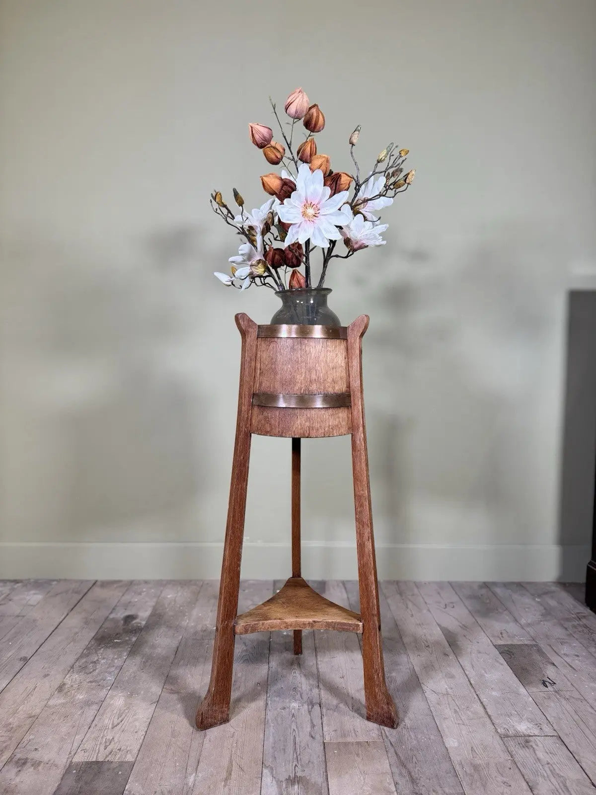 R.A. Lister antique oak jardinière plant stand coopered barrel with copper banding and splayed legs.