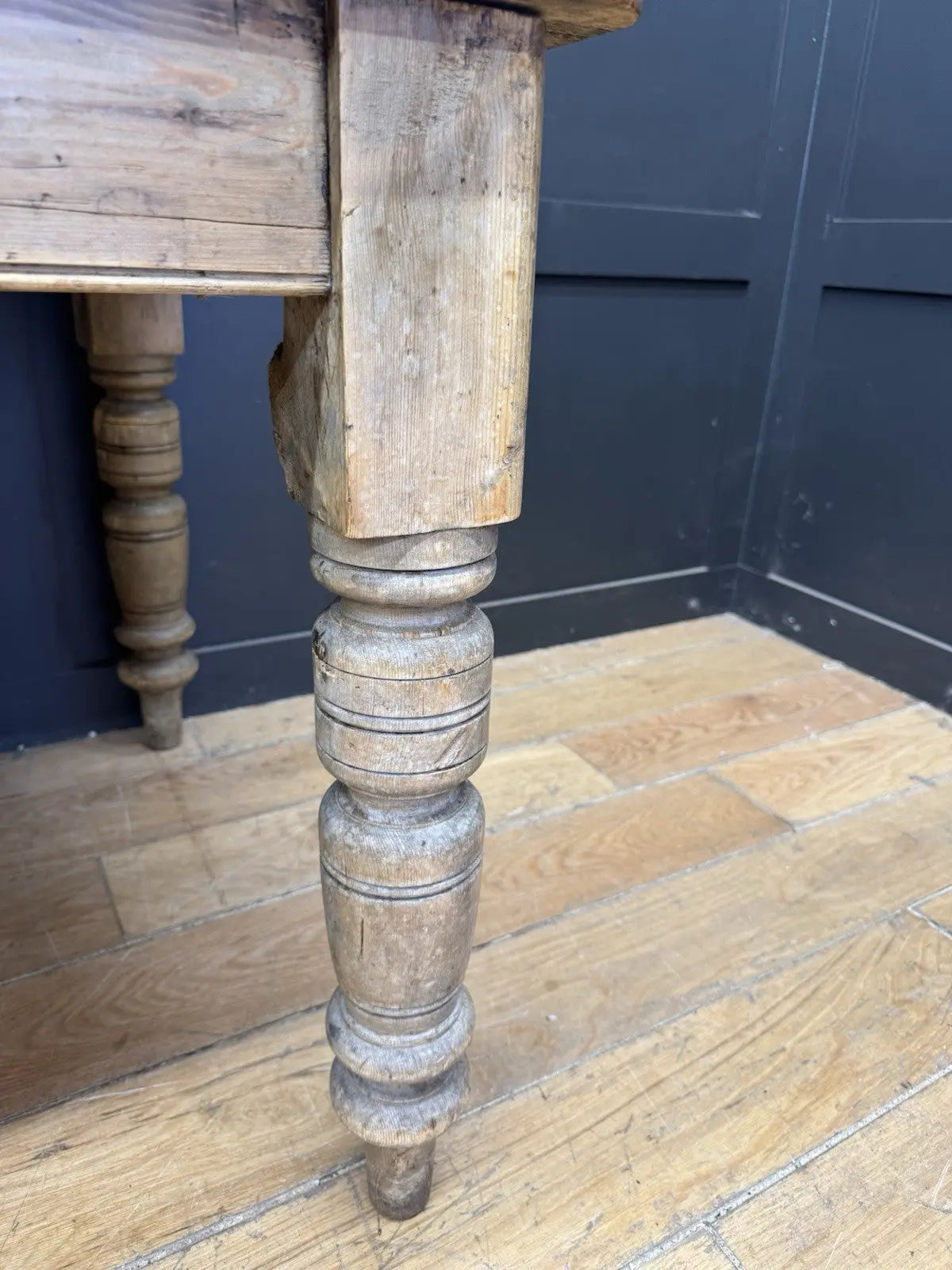 Late Victorian farmhouse kitchen table, scrubbed pine, ring-turned legs, single drawer, timeworn surface.