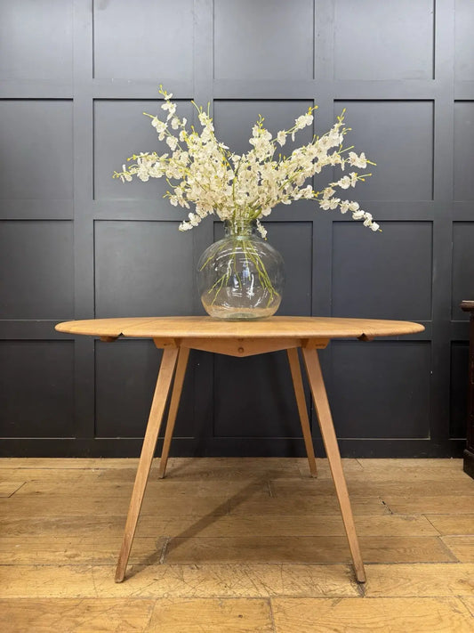 Ercol vintage drop leaf dining table, solid elm top, beech legs, mid-century design.