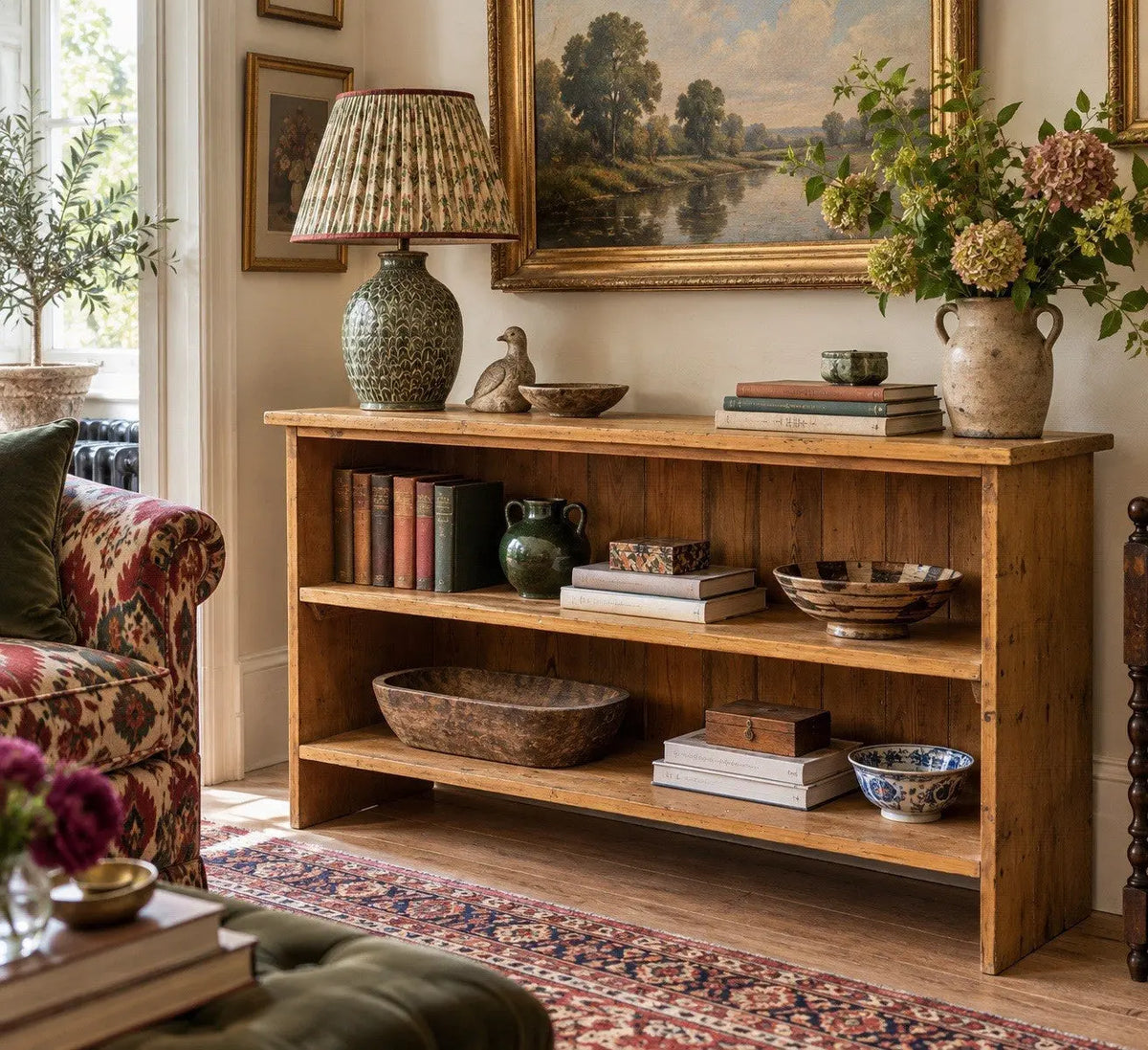 Vintage pine bookcase with warm, aged finish and two open shelves.