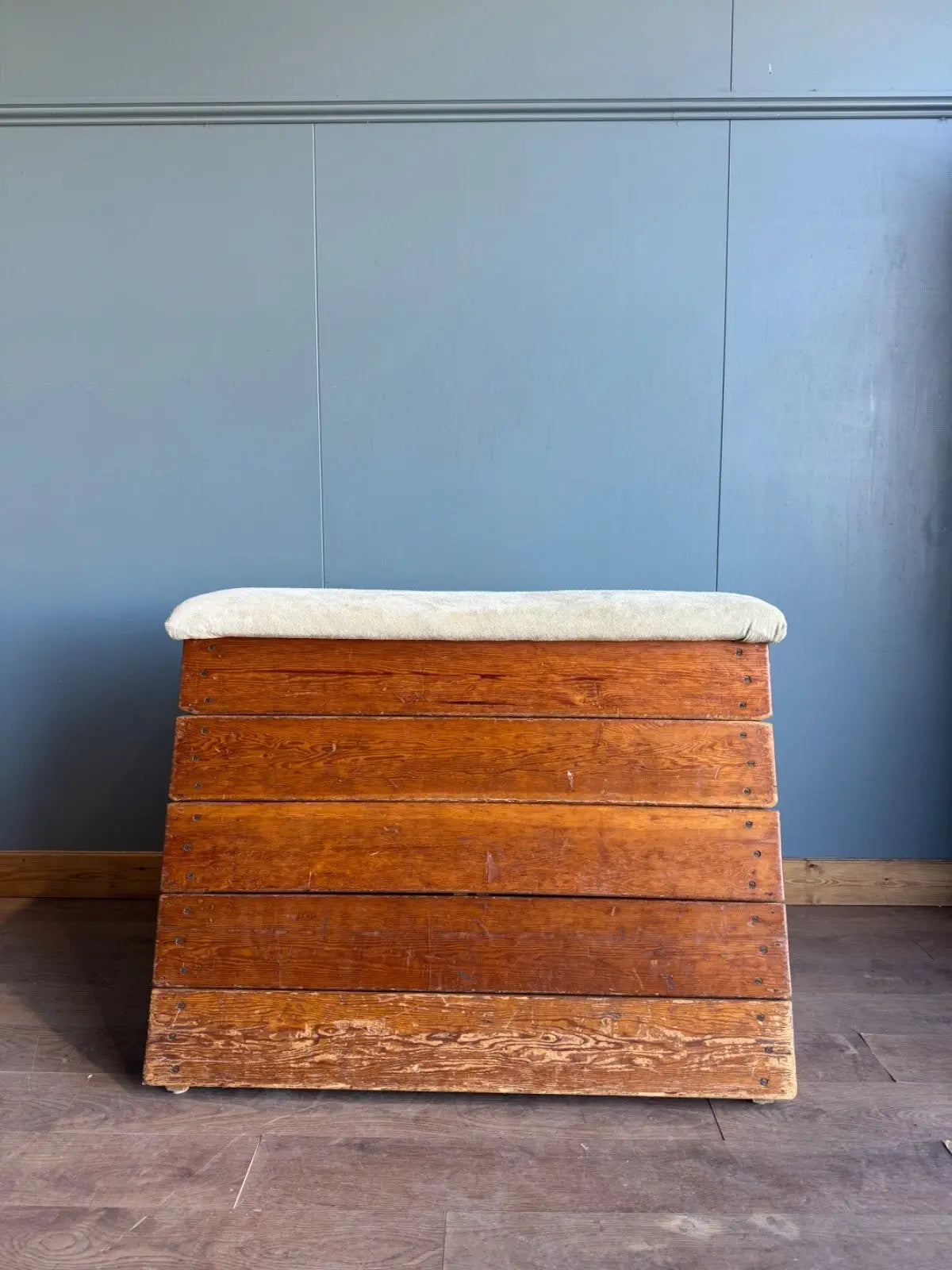 Lodge vintage wooden pommel horse with original maker's label, padded top, and worn patina.