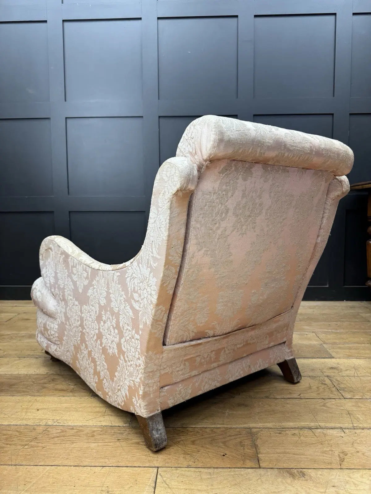 Late Victorian armchair pink silk damask floral pattern with curved rolled arms.
