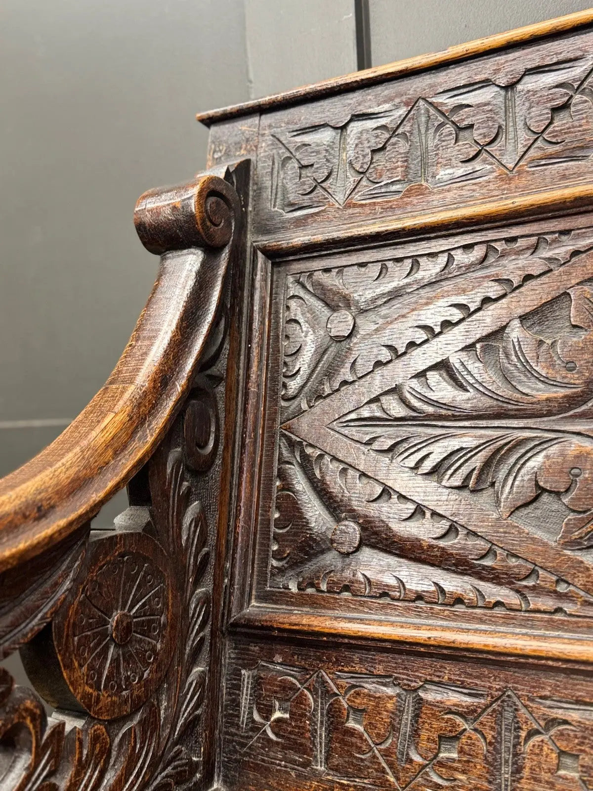 Victorian carved oak hall bench, brown, intricate Gothic Revival carvings and mythical figures.