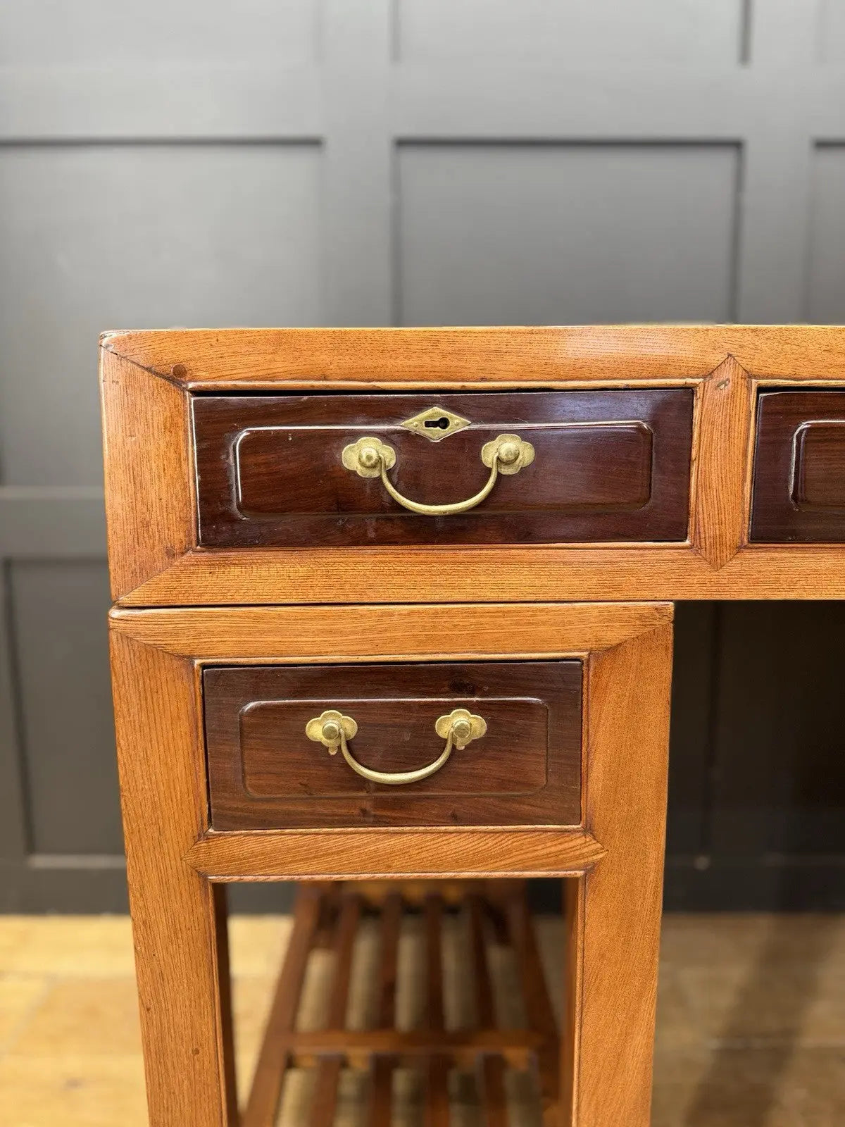 Antique Chinese hardwood writing desk, rich brown finish, elegant traditional pedestal design.