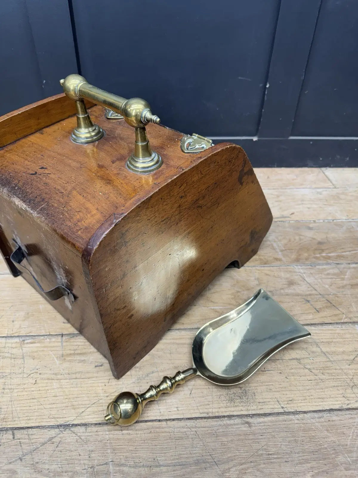 Victorian walnut coal purdonium scuttle box with brass fittings and ornate handle.
