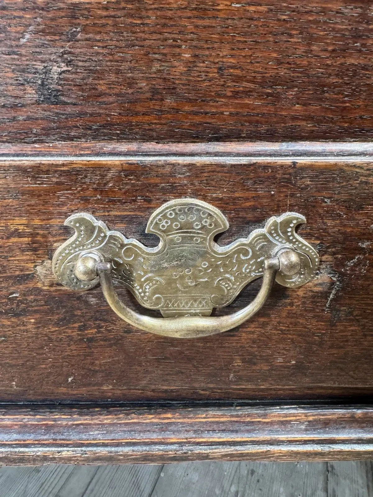 Antique oak mule chest brown four-panelled design with two drawers and rich grain.