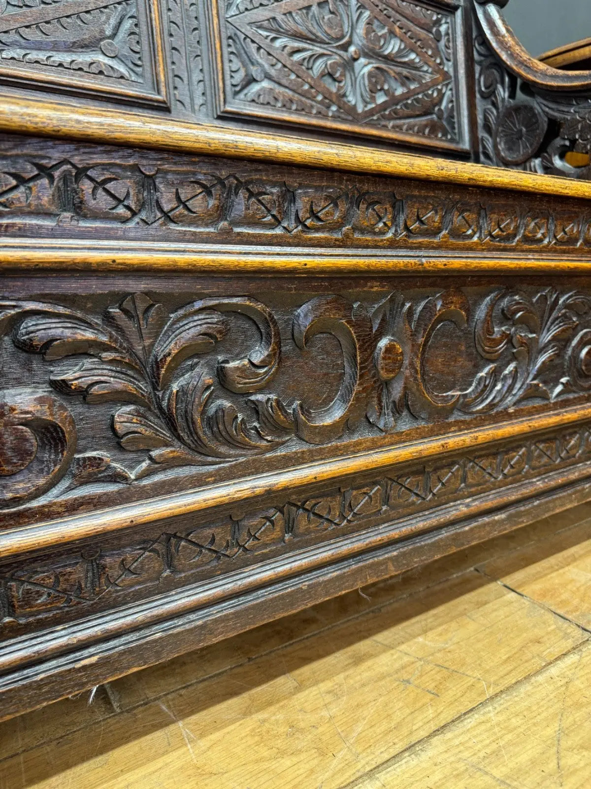 Victorian carved oak hall bench, brown, intricate Gothic Revival carvings and mythical figures.