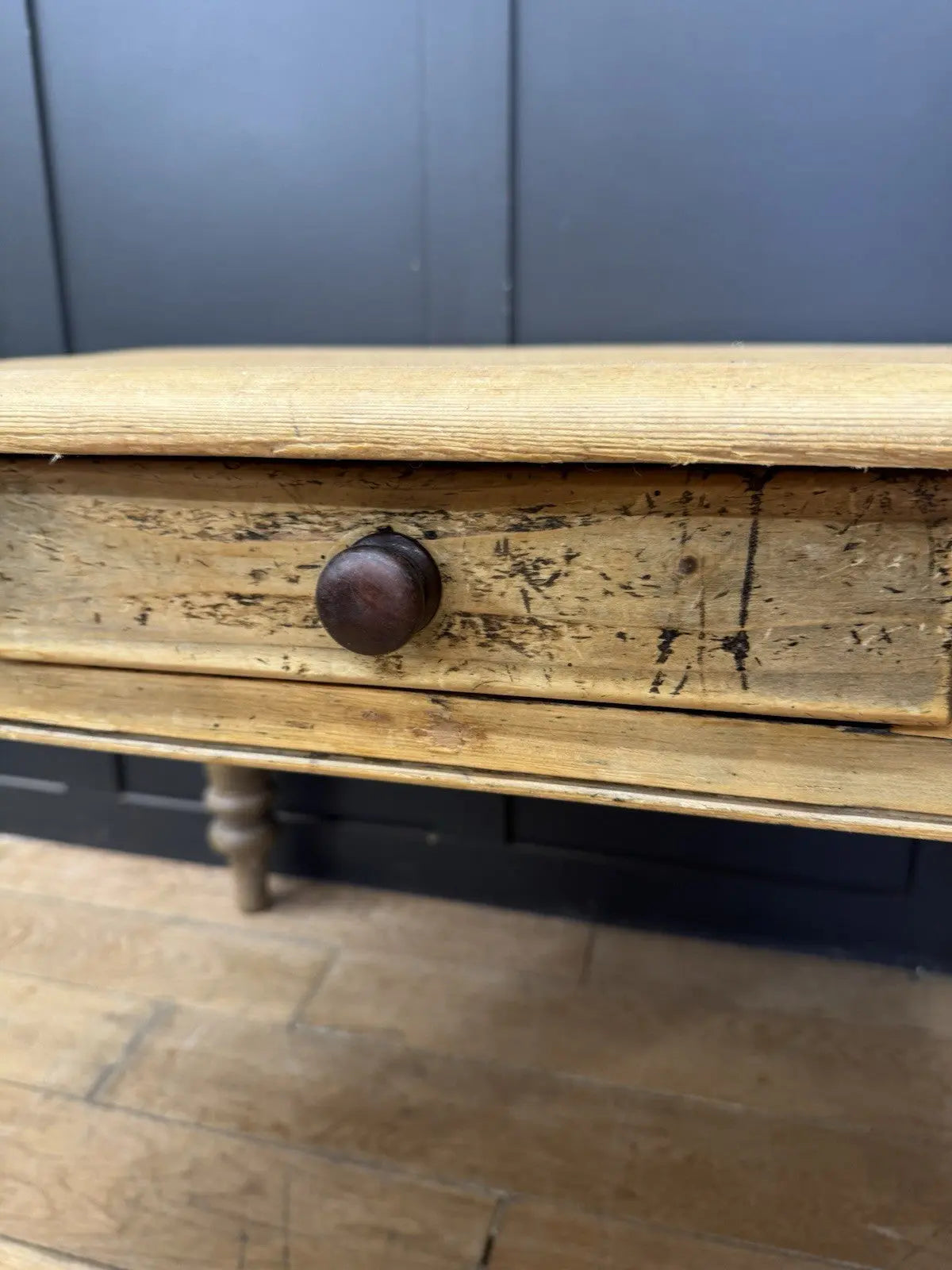 Late Victorian farmhouse kitchen table, scrubbed pine, ring-turned legs, single drawer, timeworn surface.