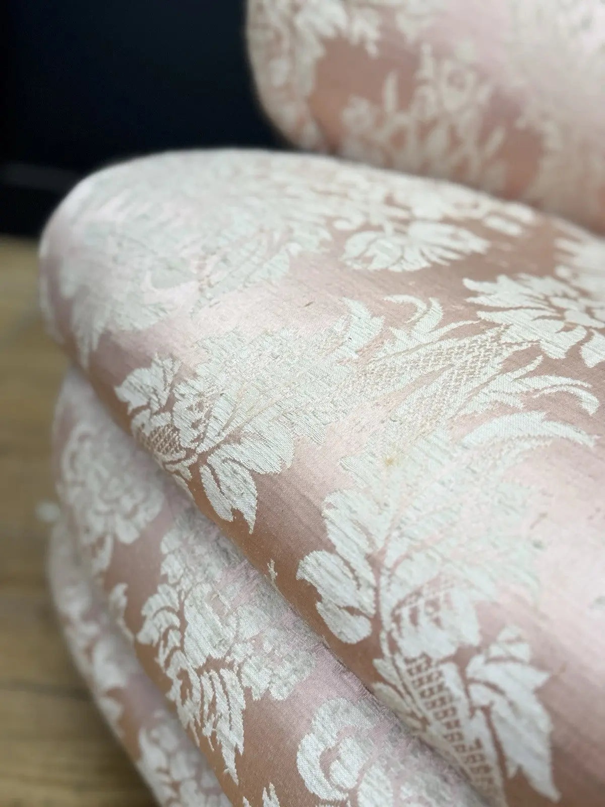 Late Victorian armchair pink silk damask floral pattern with curved rolled arms.