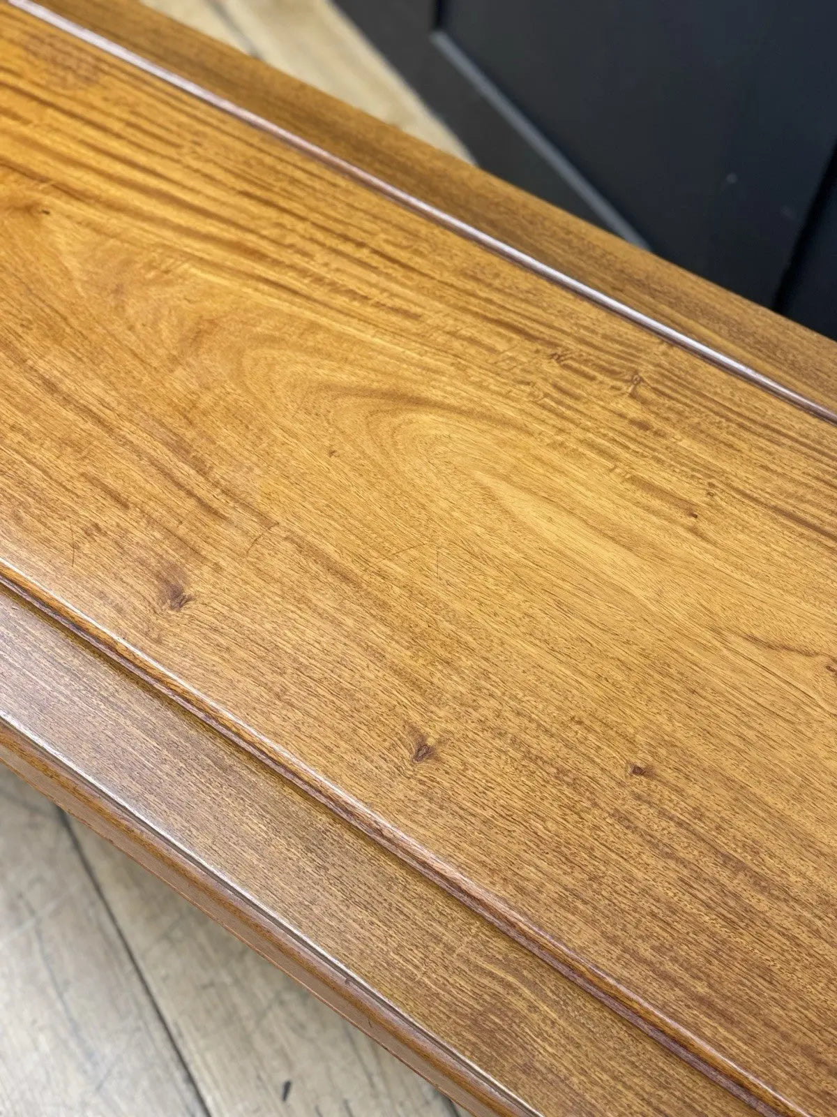 Contemporary Chinese hardwood coffee table brown rectangular top with framed construction and square legs.
