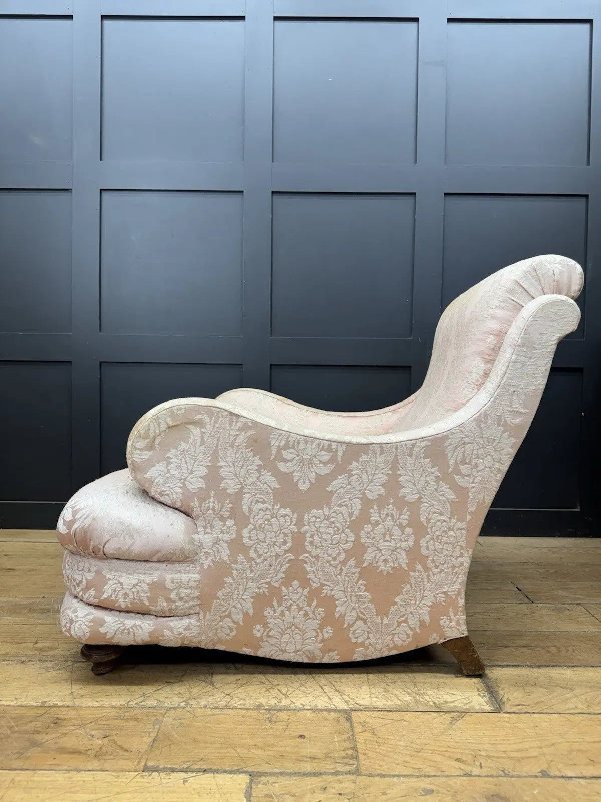 Late Victorian armchair pink silk damask floral pattern with curved rolled arms.