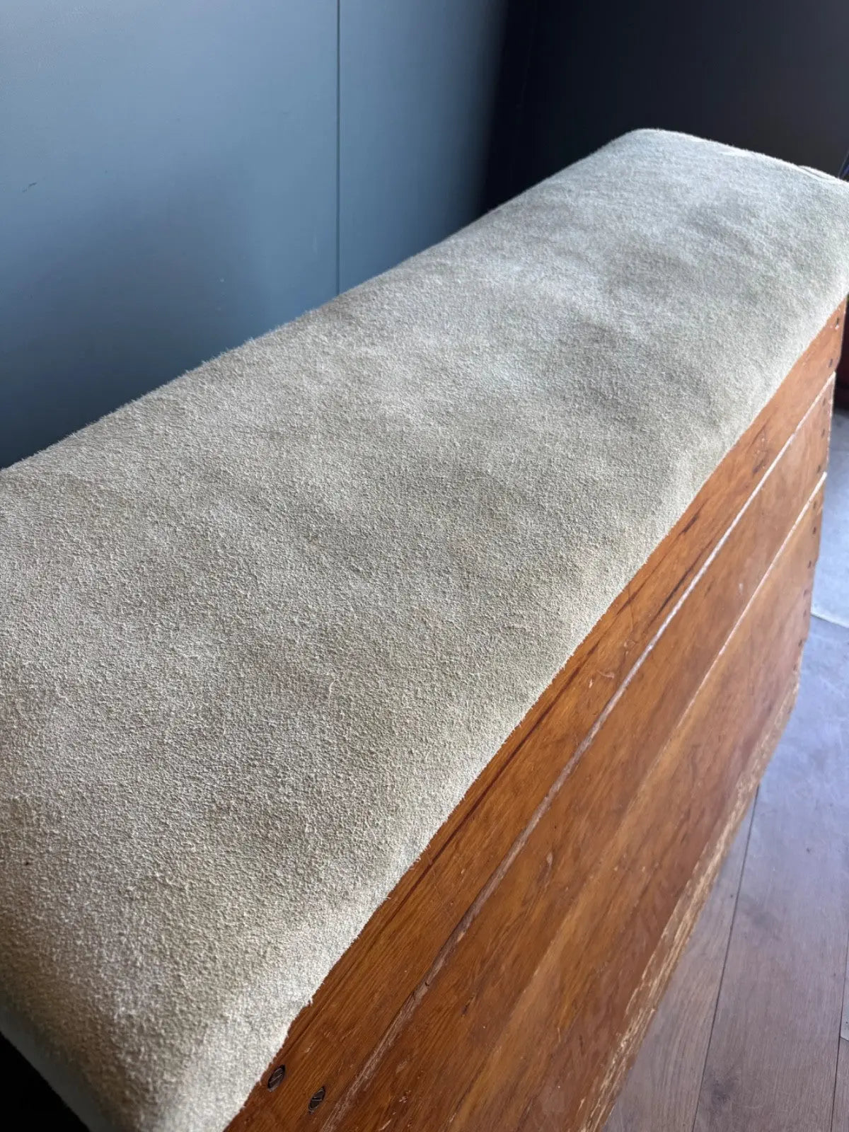Lodge vintage wooden pommel horse with original maker's label, padded top, and worn patina.