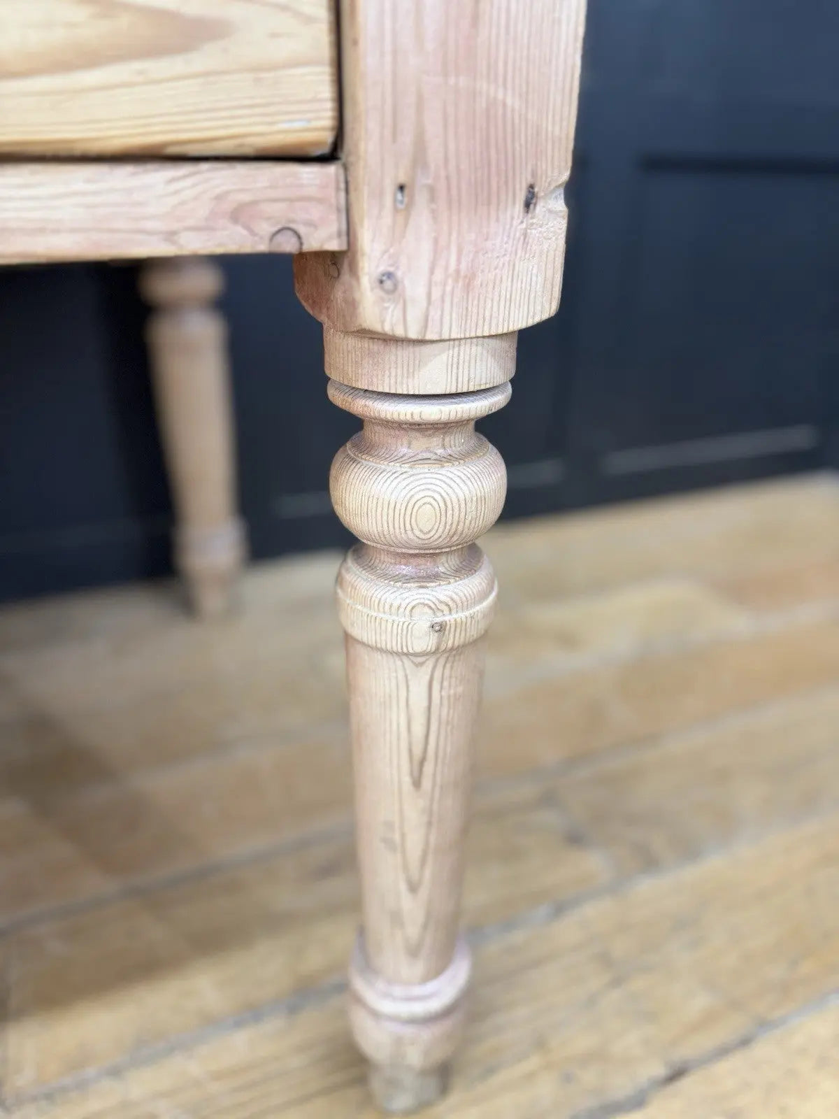 Victorian pine farmhouse dining table brown solid plank top with two drawers and ceramic knobs.