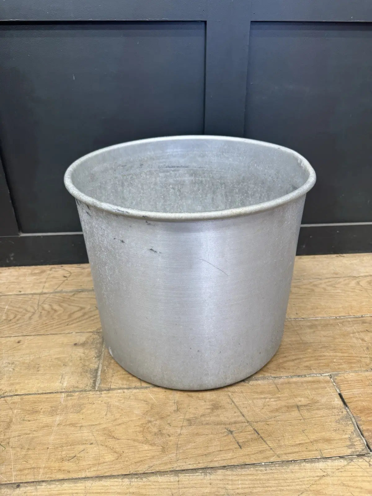 Parisotto green aluminium planters set of seven with cylindrical bodies and maker's label.