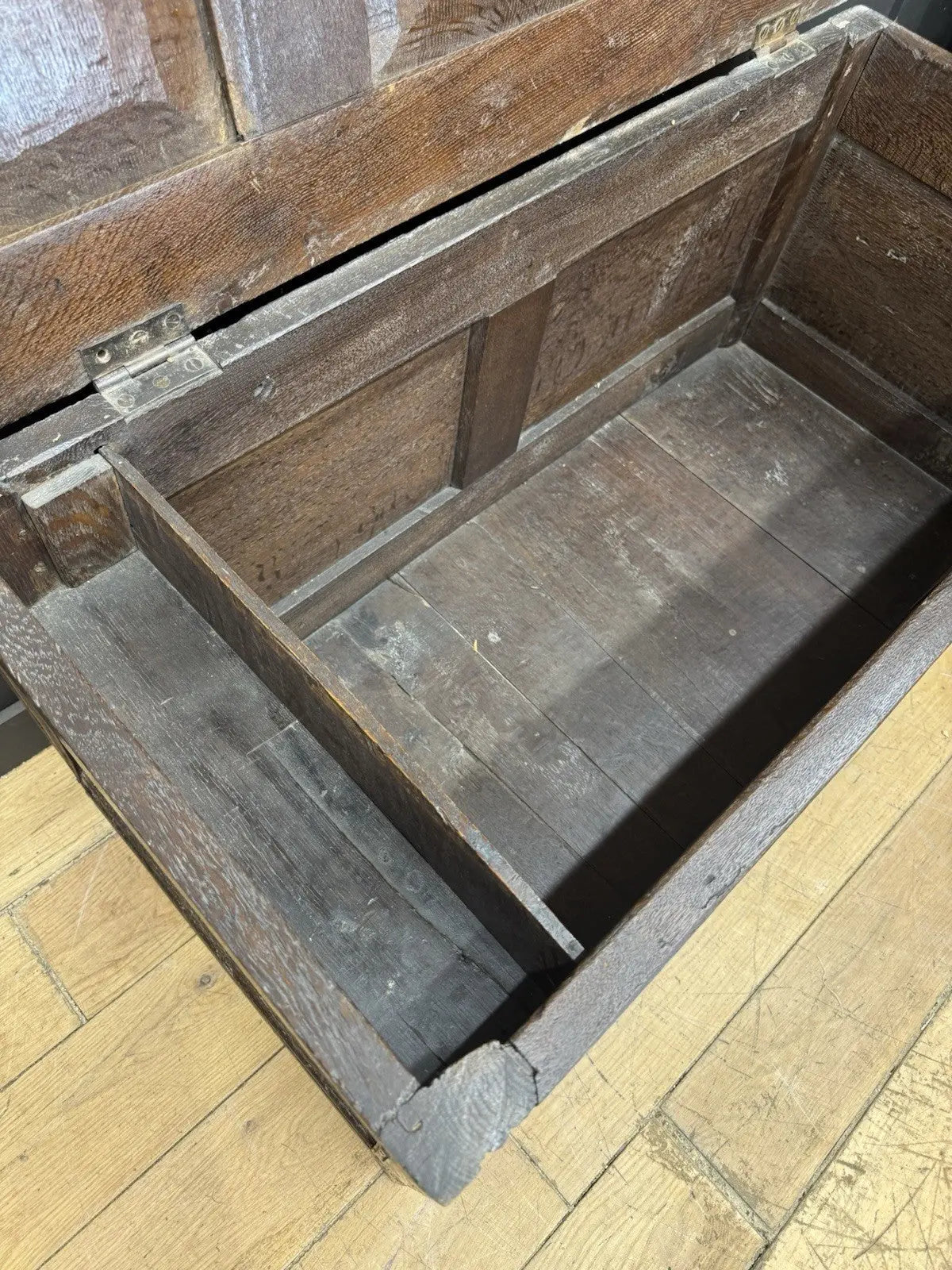 Antique oak hope chest brown with intricate floral carvings and spacious interior.