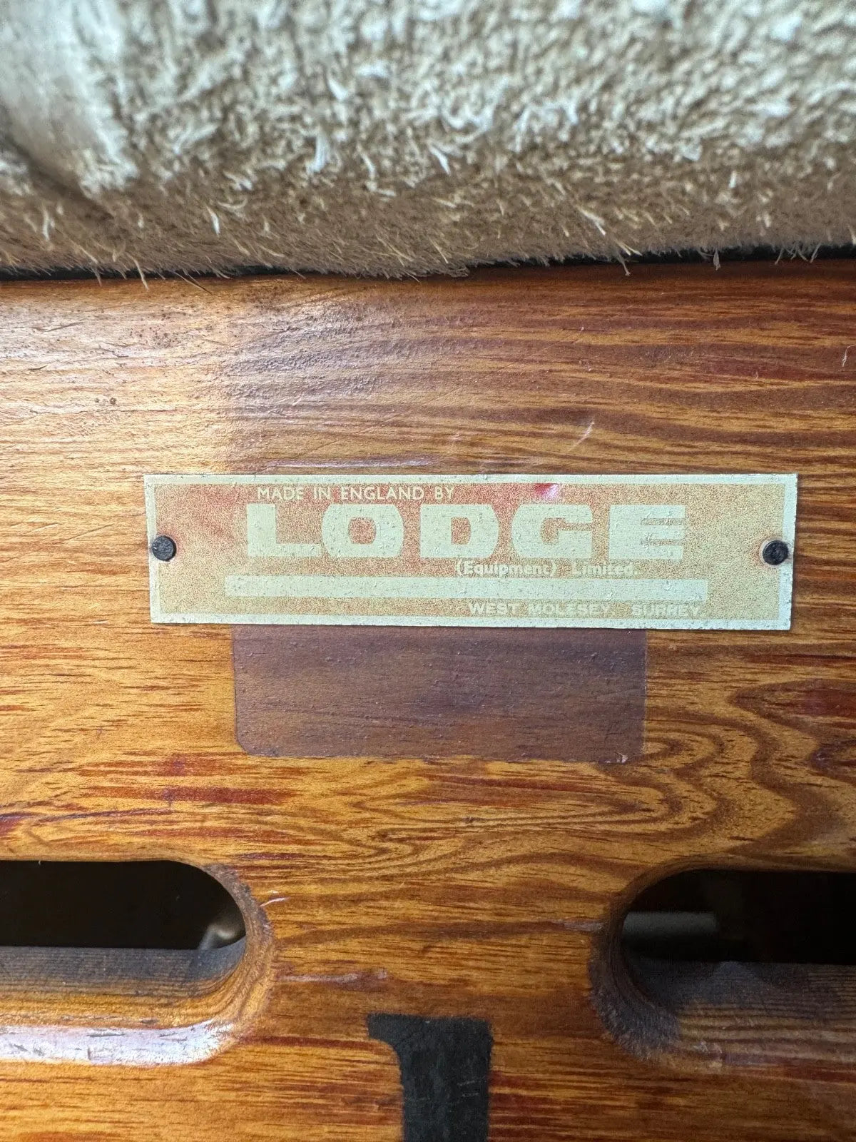 Lodge vintage wooden pommel horse with original maker's label, padded top, and worn patina.