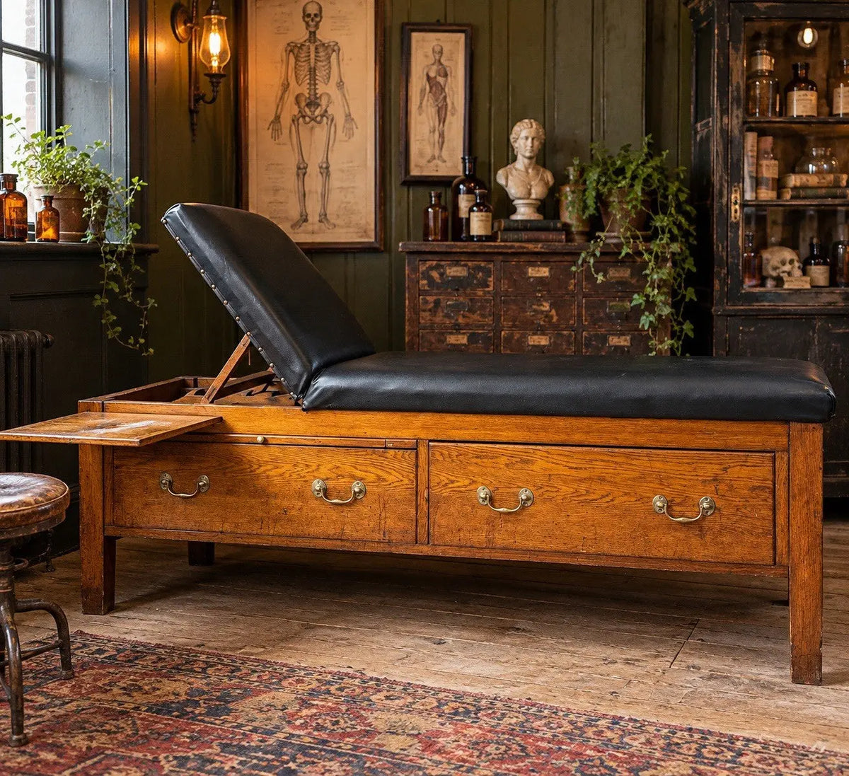 Harris black chaise longue with oak frame, padded Rexine seat, and original maker's plaque.