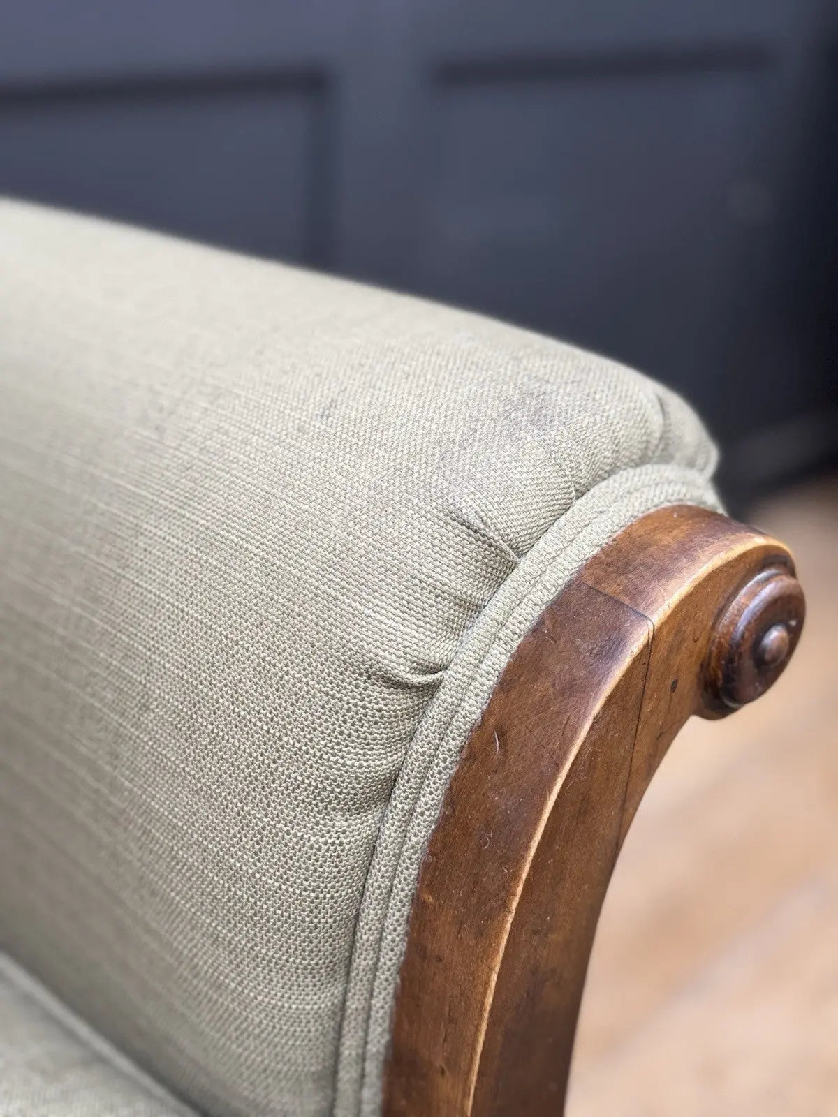 French's green Art Deco armchairs with walnut scroll arms and tapered legs.