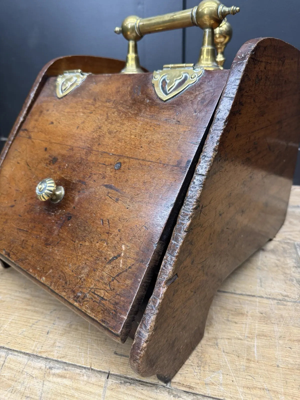 Victorian walnut coal purdonium scuttle box with brass fittings and ornate handle.