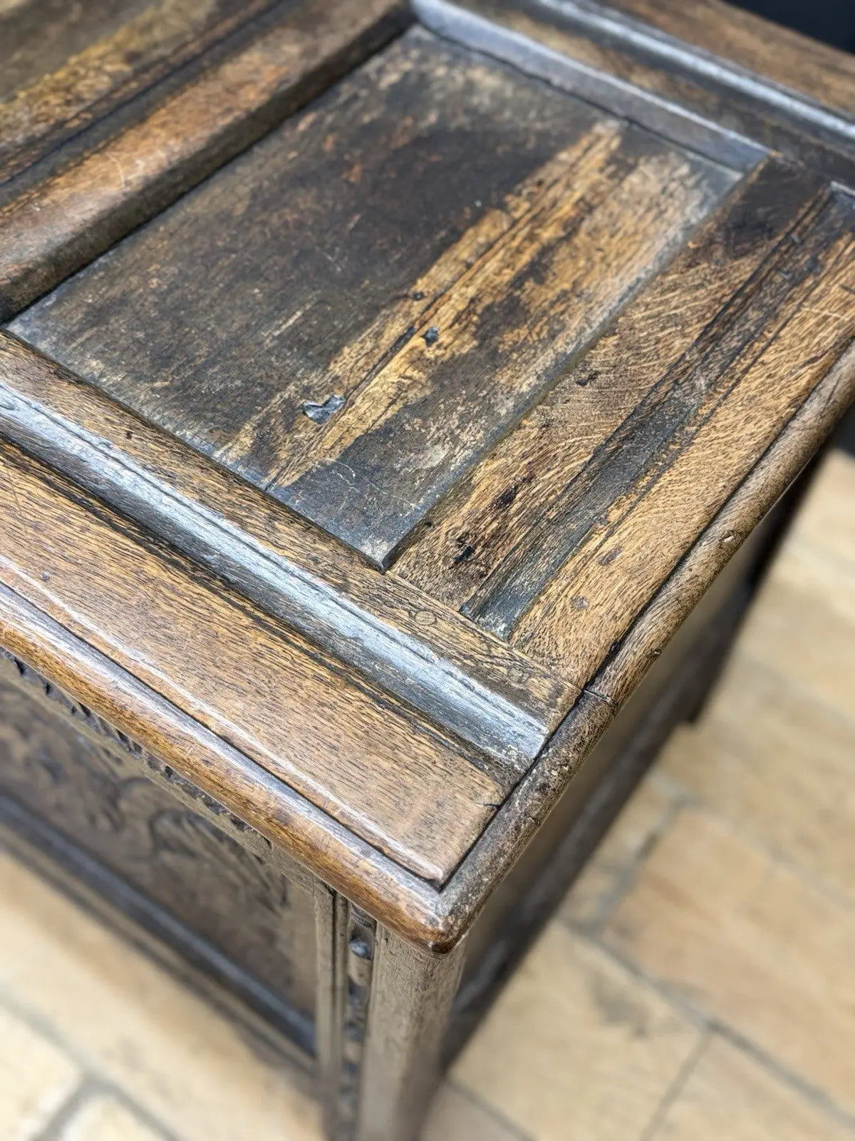 Antique oak hope chest brown with intricate floral carvings and spacious interior.