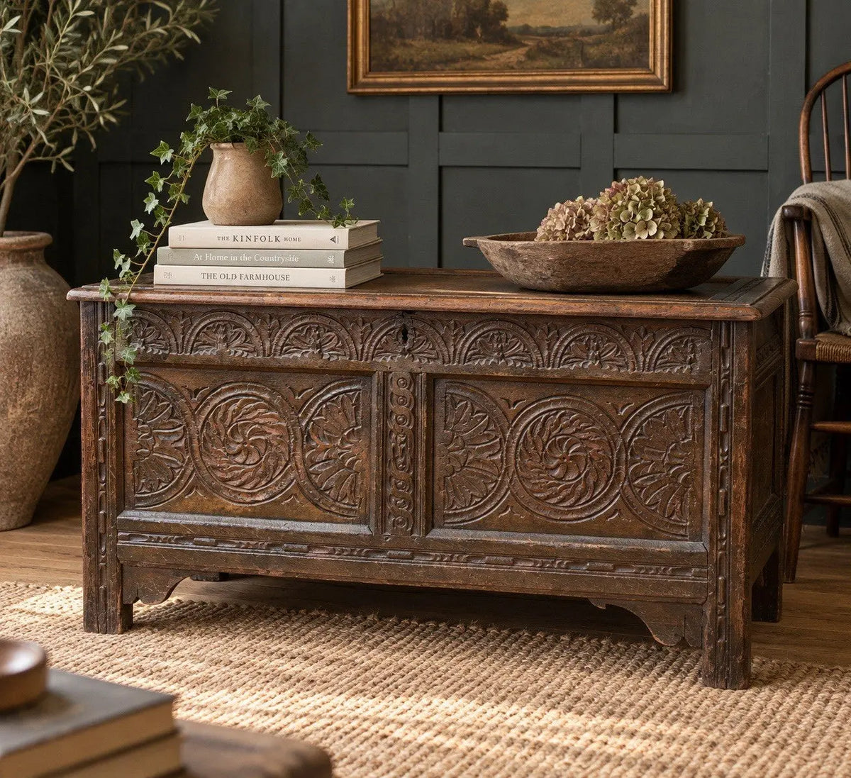 Antique oak hope chest brown with intricate floral carvings and spacious interior.