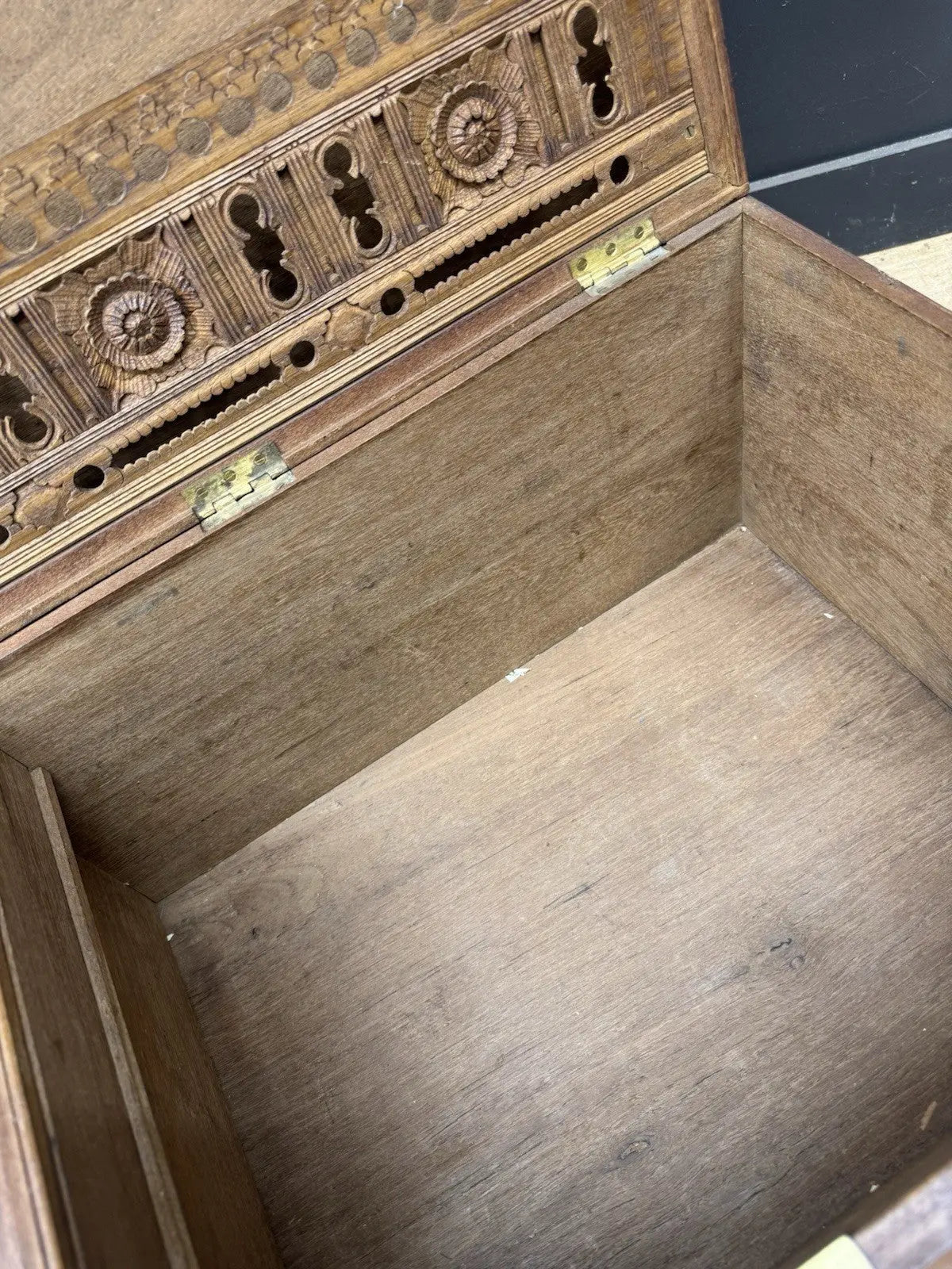Antique Anglo-Burmese teak campaign chest trunk with brass strapwork and drop-handle.