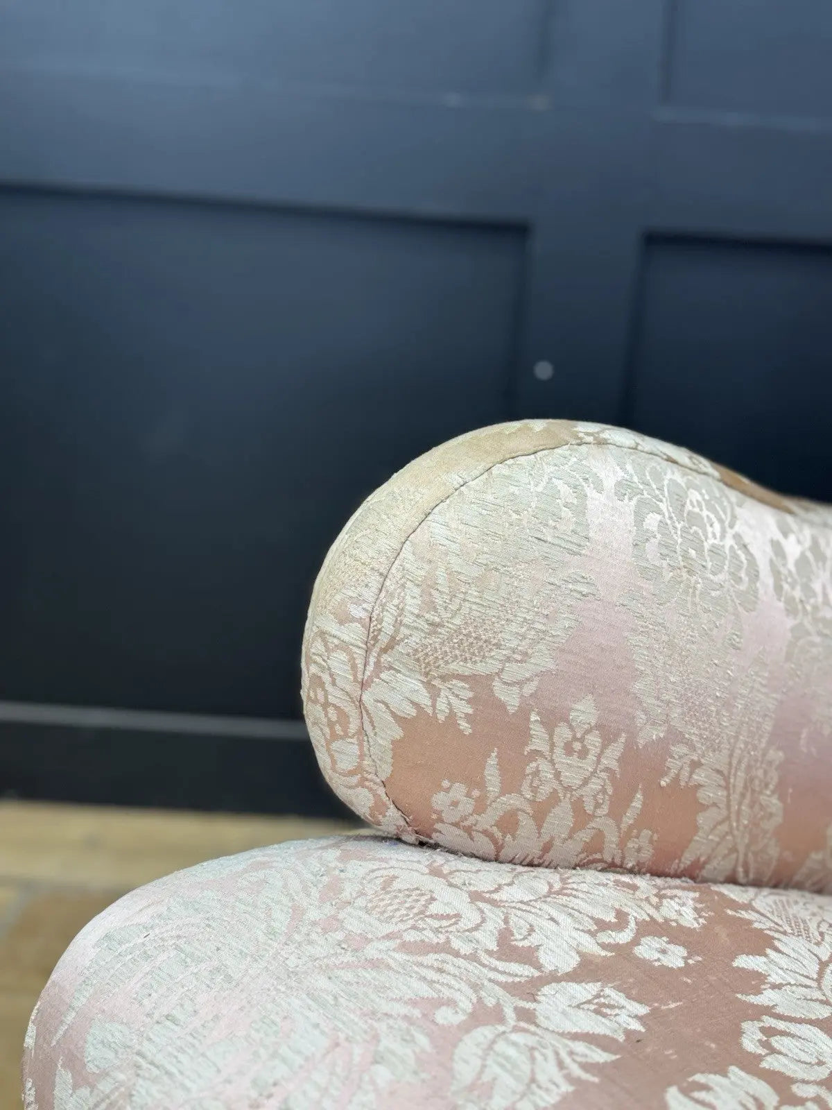 Late Victorian armchair pink silk damask floral pattern with curved rolled arms.