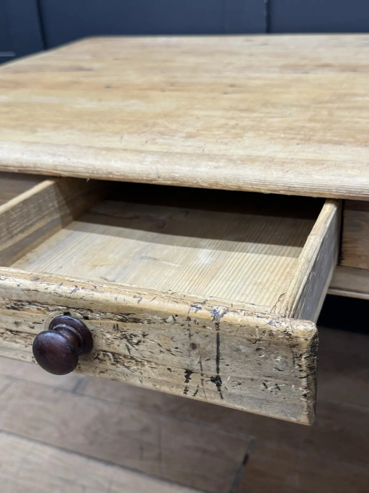 Late Victorian farmhouse kitchen table, scrubbed pine, ring-turned legs, single drawer, timeworn surface.