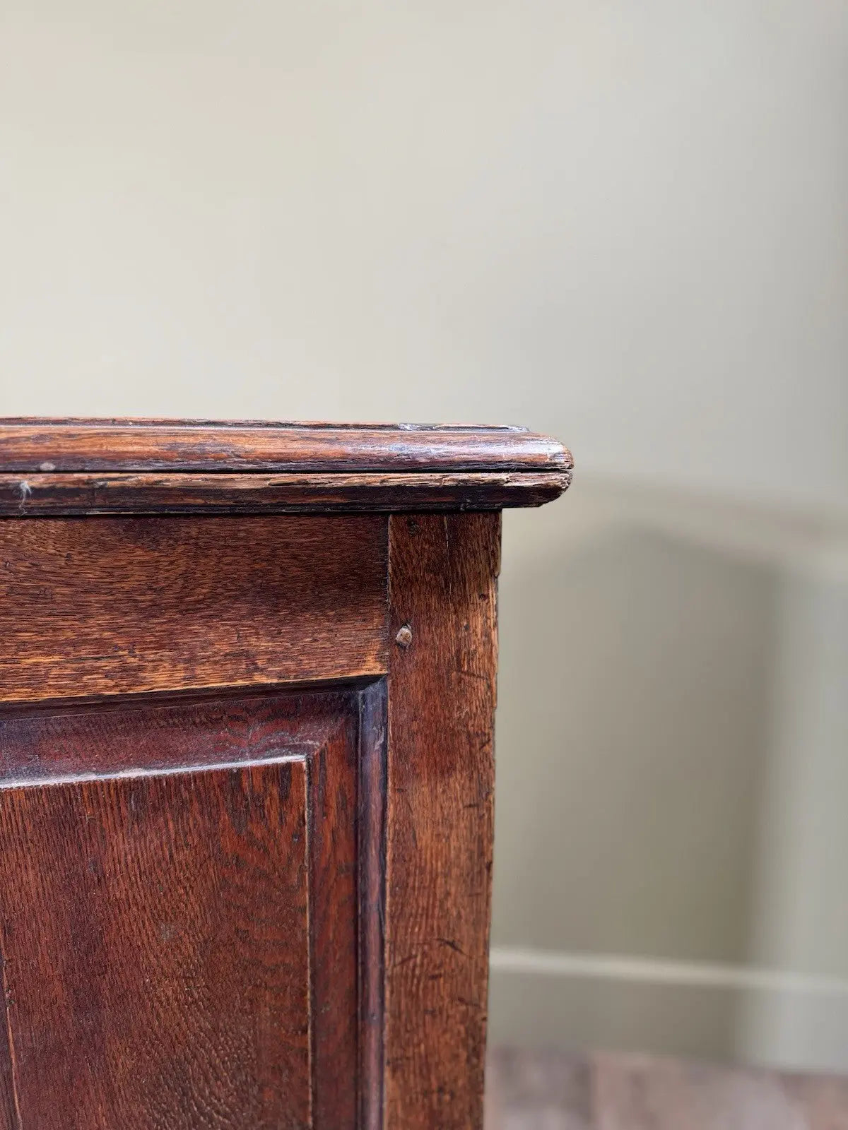 Antique oak mule chest brown four-panelled design with two drawers and rich grain.