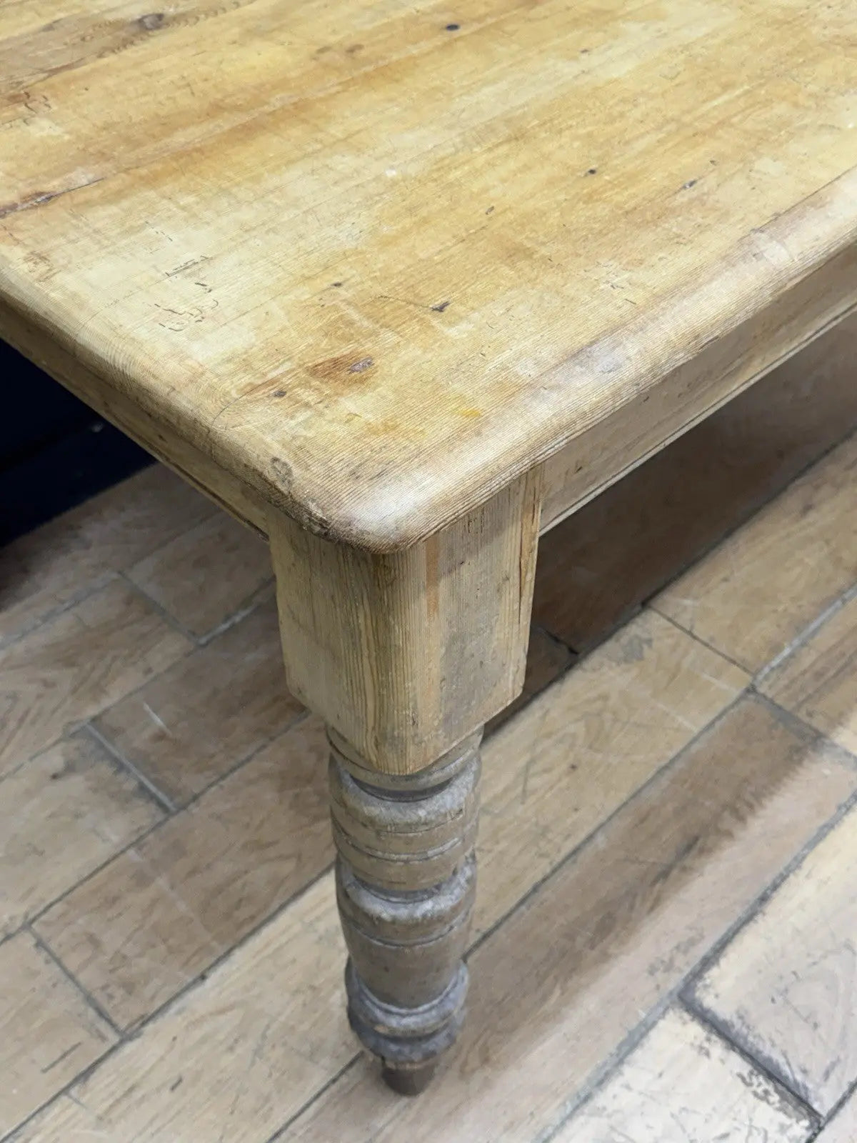 Late Victorian farmhouse kitchen table, scrubbed pine, ring-turned legs, single drawer, timeworn surface.