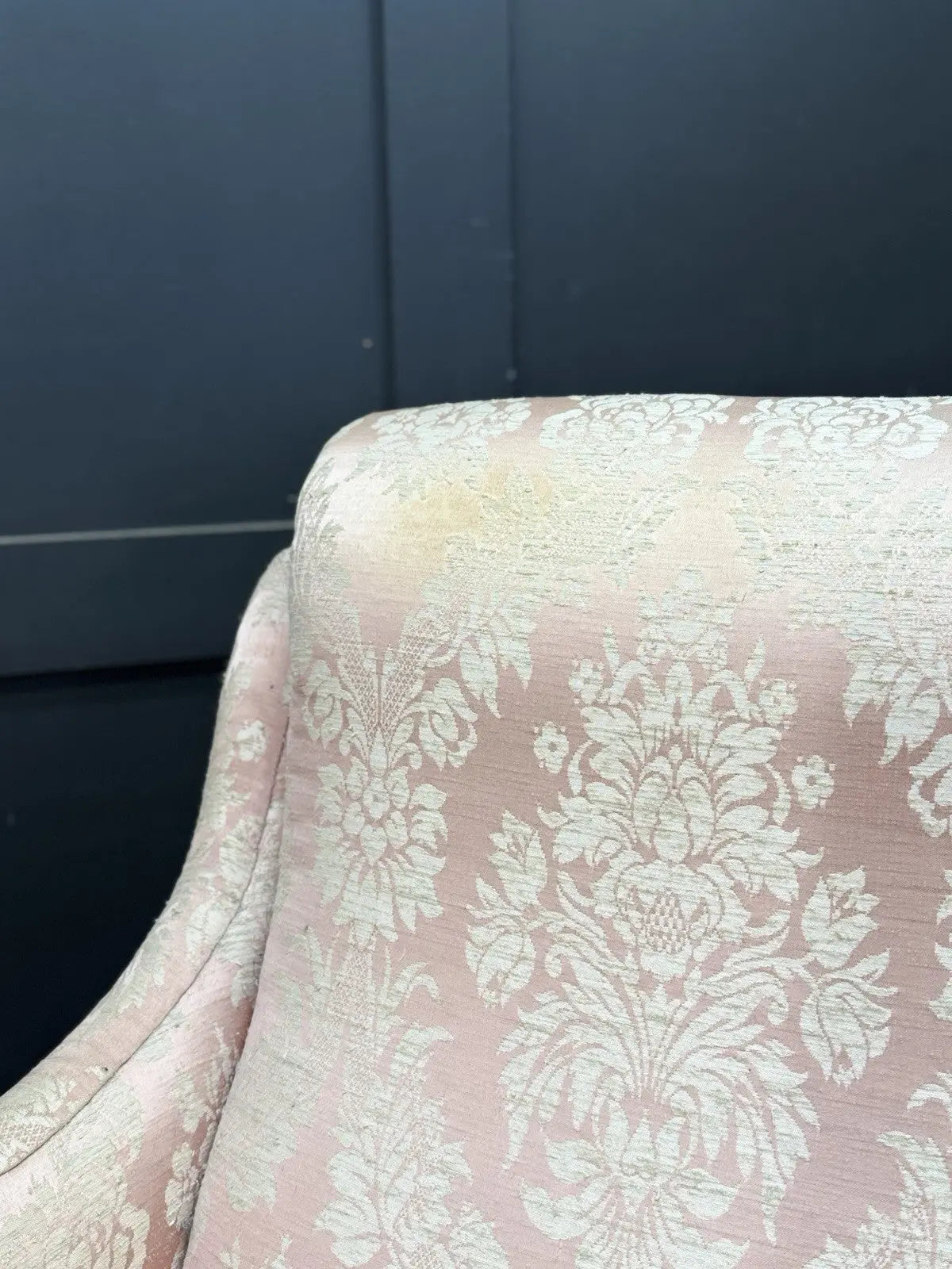 Late Victorian armchair pink silk damask floral pattern with curved rolled arms.
