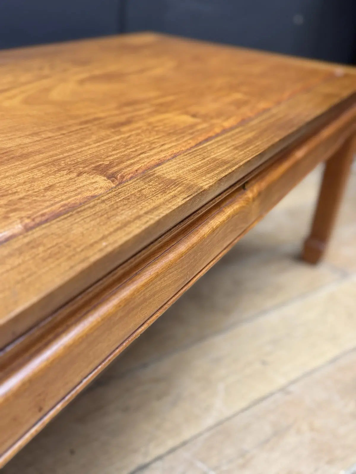Contemporary Chinese hardwood coffee table brown rectangular top with framed construction and square legs.