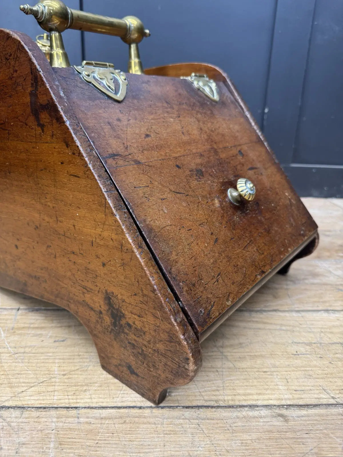 Victorian walnut coal purdonium scuttle box with brass fittings and ornate handle.